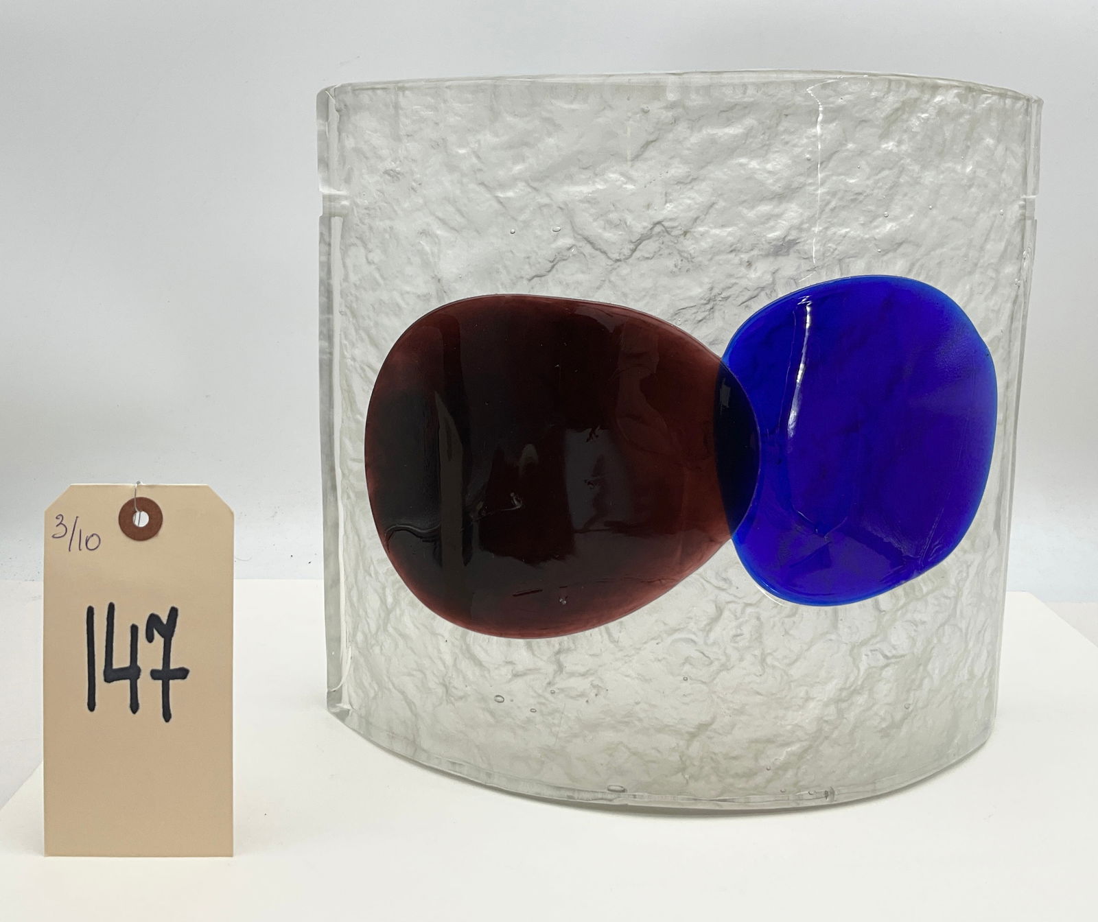 Venini Murano Art Glass Sculpture Textured Ice Finish with Fused Medallions: This modernist Murano art glass sculpture by Venini features a thick, curved rectangular panel with a heavily textured ice glass finish. The clear glass body is accented by two large, fused circular m