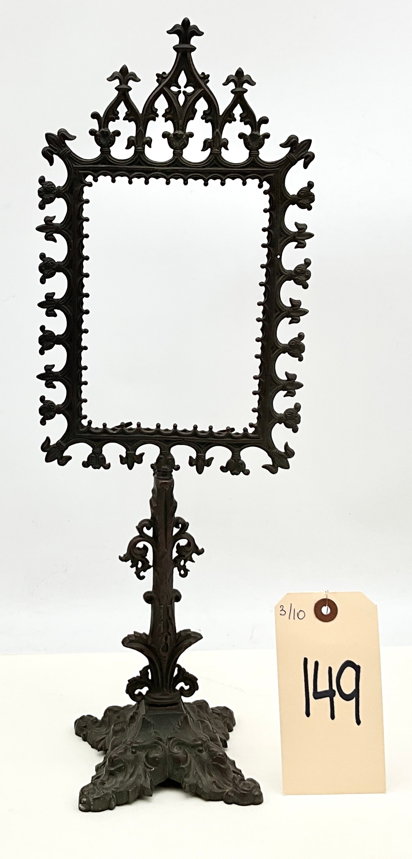 Cast Iron, Adjustable Pedestal Frame, Gothic Revival: This cast iron, 19th-century adjustable pedestal frame is an unmarked piece of cast metal construction featuring ornate Gothic Revival motifs. The rectangular frame is decorated with a pierced fleur-d