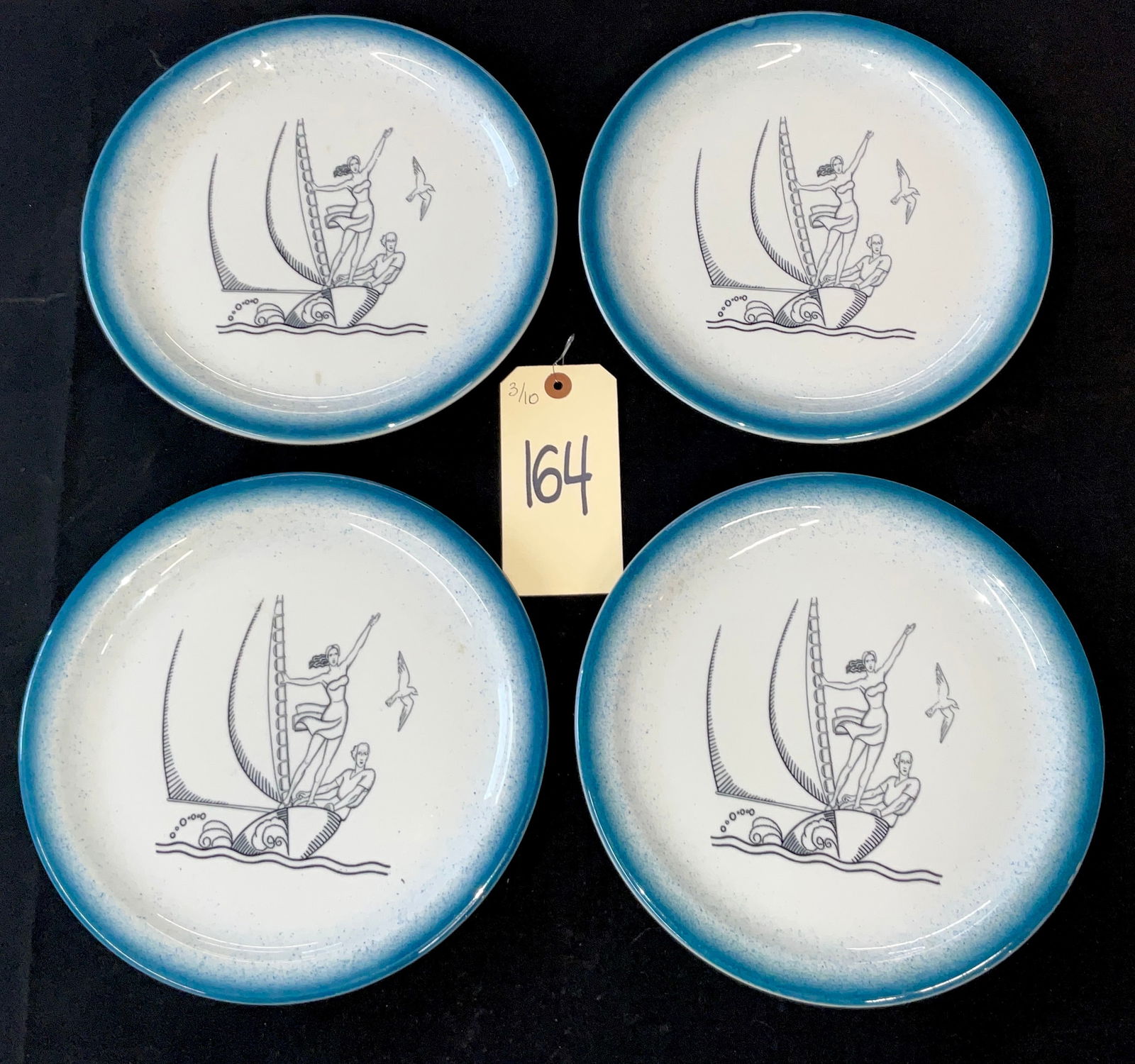 Shenango China Set of Four Vintage Ceramic Plates with Art Deco Sailboat Motif: This set of four vintage ceramic restaurant ware plates was manufactured by Shenango China of New Castle, Pennsylvania. Each plate features a central Art Deco-style black line-art illustration of a ma