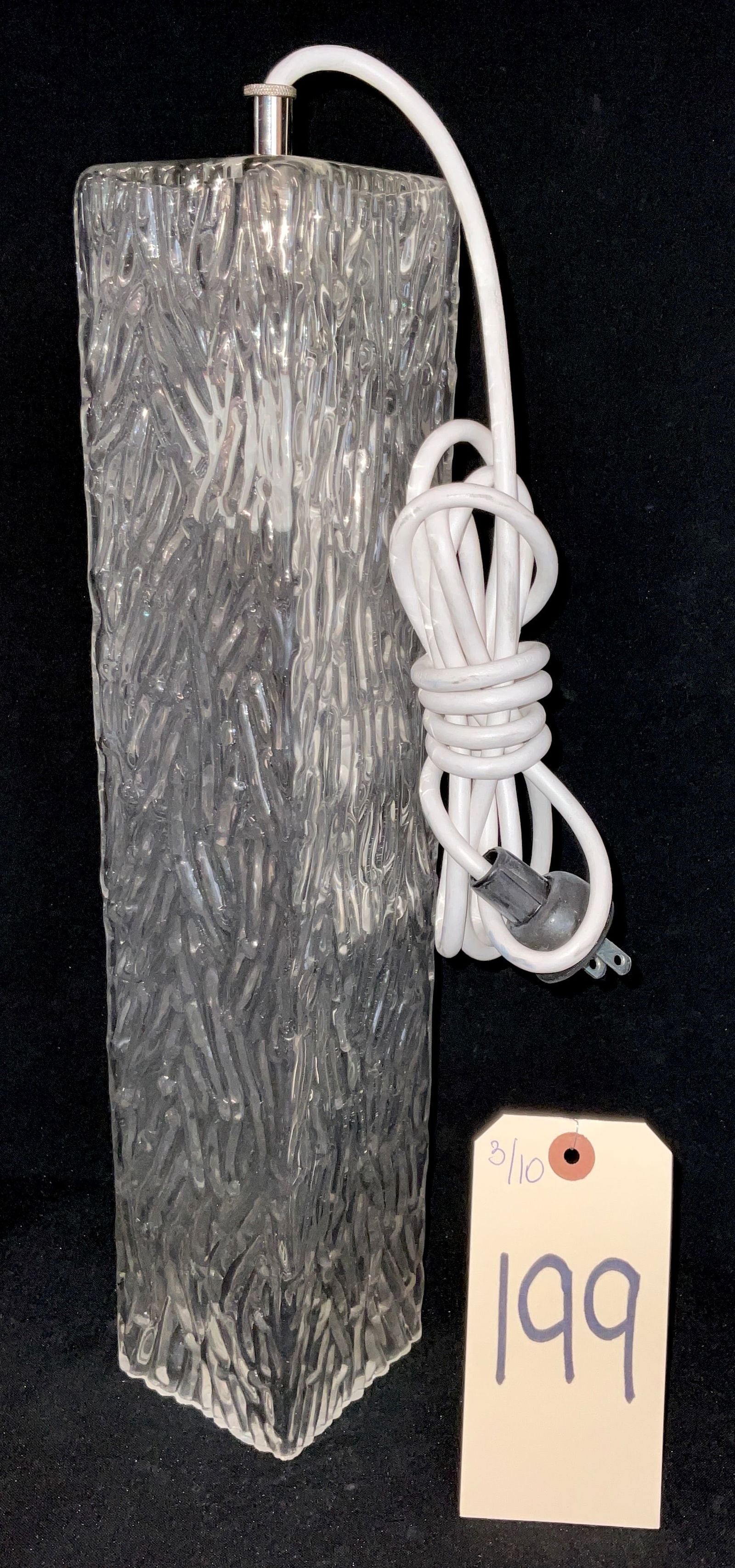 Murano Ice Glass Table Lamp: This Mid-Century Modern table lamp features a rectangular column body of thick Murano glass with a heavy ice or bark-like texture. Attributed to J.T. Kalmar, the Brutalist design is accented by a poli