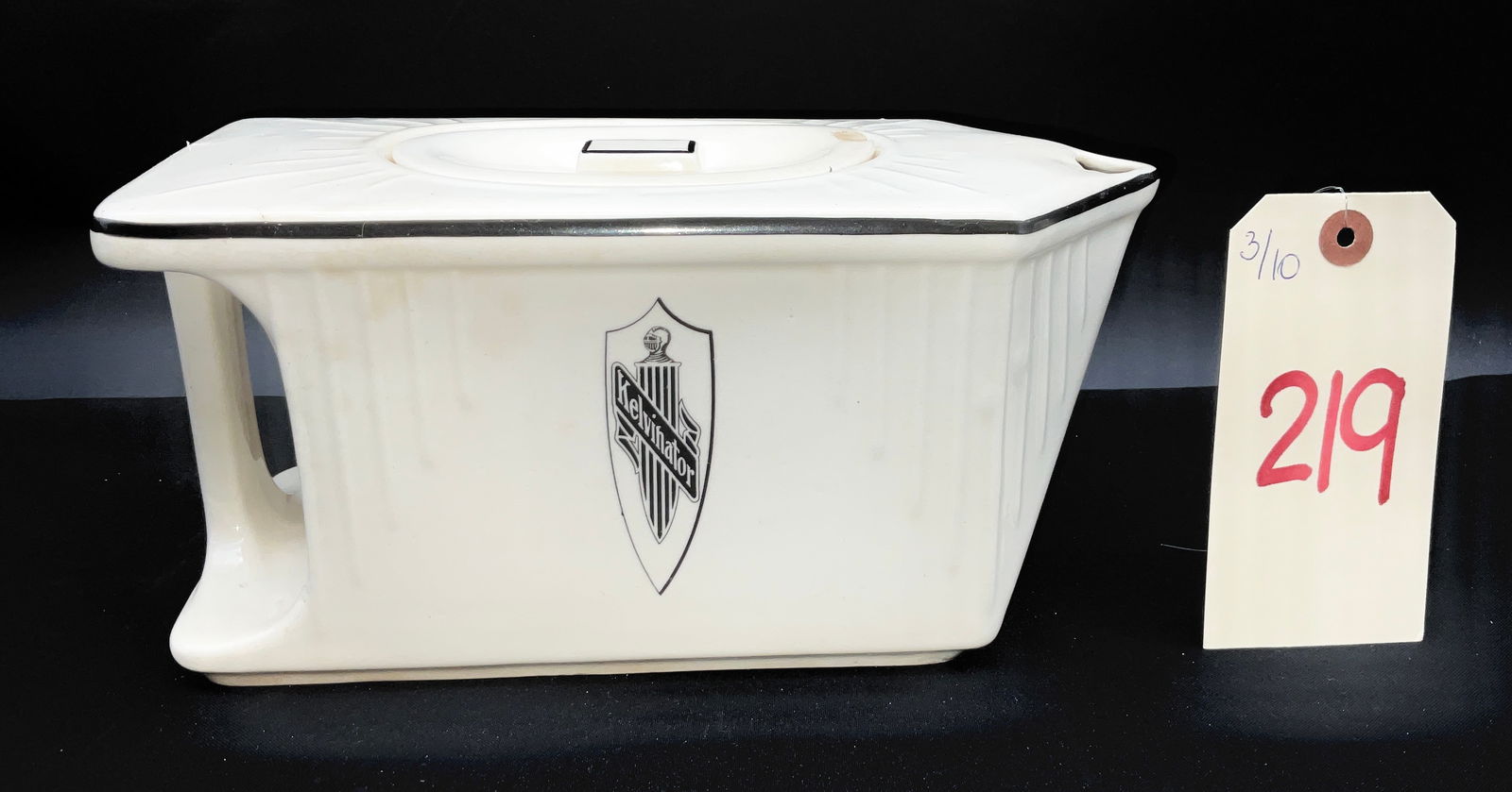 Art Deco Gem Clay Form Co. Kelvinator Refrigerator Water Pitcher: This Art Deco refrigerator water pitcher was manufactured by the Gem Clay Form Company of Sebring, Ohio, circa 1930, for the Kelvinator Corporation. The cream-colored ceramic body features a streamlin