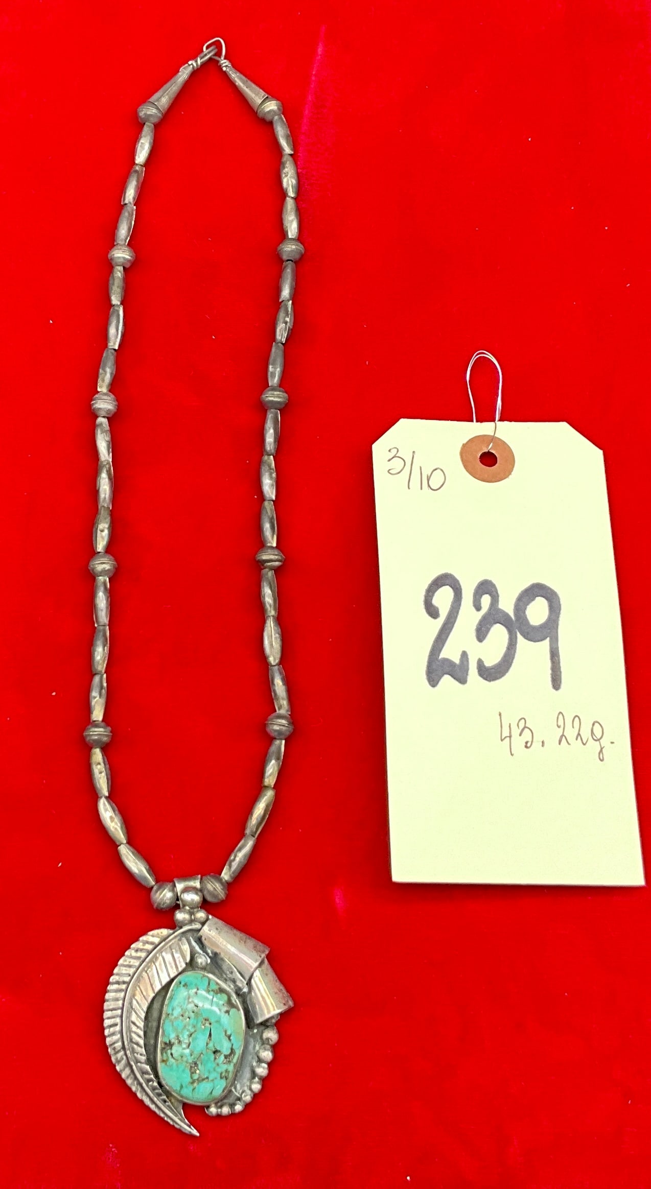 Navajo Sterling Silver Turquoise Pendant Necklace, Signed T. Begay, 43.22 Grams: This Navajo Old Pawn style necklace features a large pendant handcrafted in silver that tests as sterling, signed by artist T. Begay. The pendant is set with a vibrant blue-green cabochon that appears