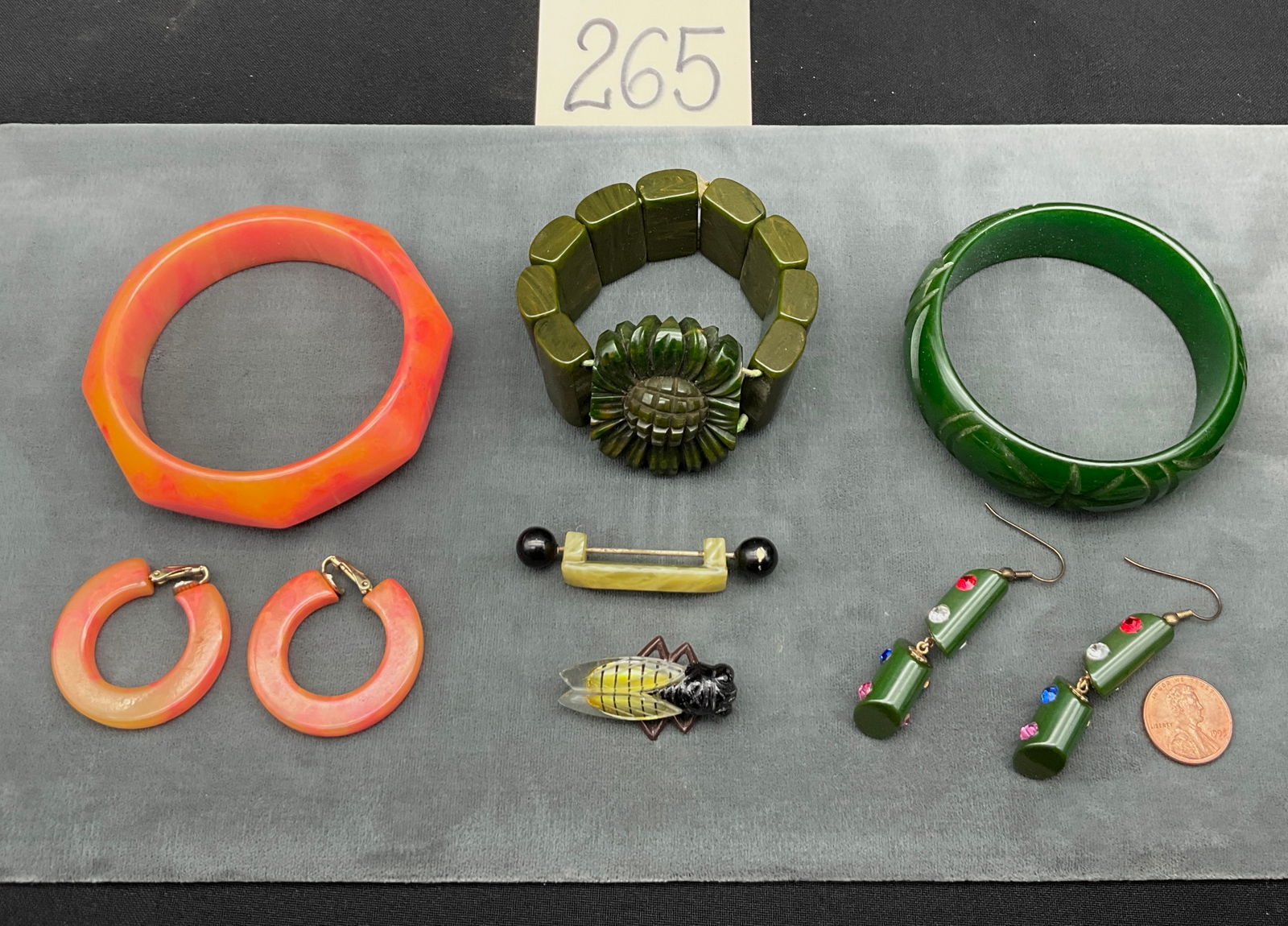 Bakelite, Figural Bee and Art Deco Bar: This collection features two Bakelite brooches including a figural bee with translucent wings and an Art Deco bar pin with marbled yellow-green plastic and black spherical ends. The lot also contains