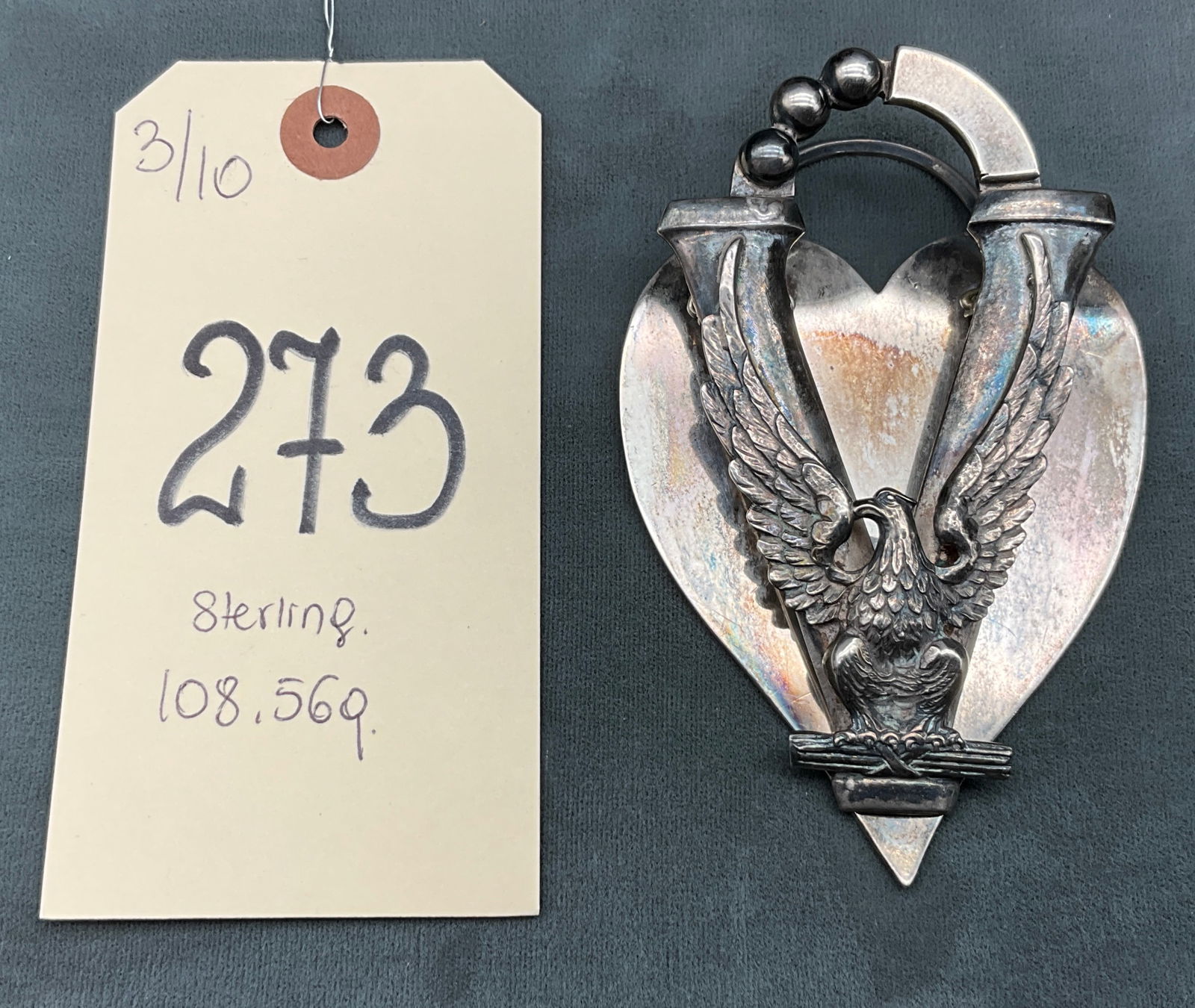Guglielmo Cini Sterling Silver V for Victory Eagle Heart Bookmark: This substantial Guglielmo Cini sterling silver bookmark features a patriotic V for Victory eagle design perched atop a fasces and a polished heart-shaped base. The versatile piece includes a horizont