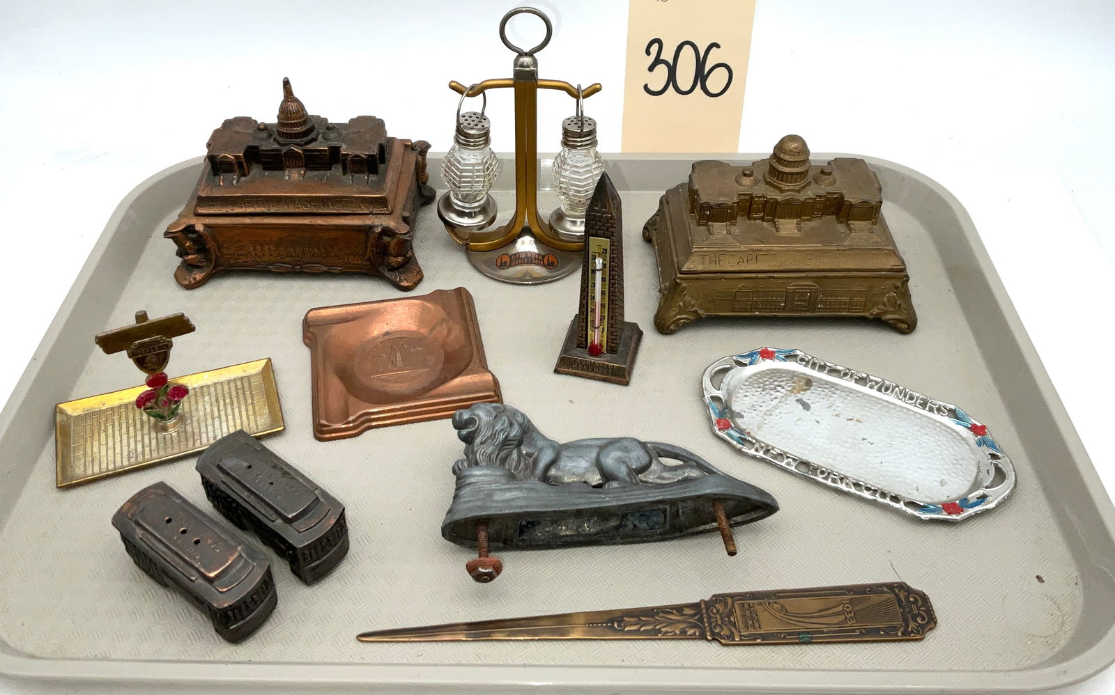 A Collection of Vintage American Landmark and World's Fair Souvenir Items: This collection features various commemorative metal and glass objects from mid-20th-century American landmarks and expositions. Included are two hinged trinket boxes modeled after the United States C
