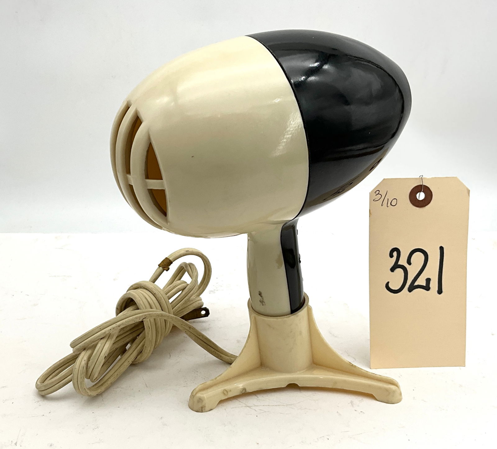 Driaire Tabletop Hair Dryer, Mid-Century Modern Bullet Design: This mid-century modern Driaire tabletop hair dryer was manufactured by Driaire, Inc. of South Norwalk, Connecticut. The appliance features a streamlined, two-tone cream and black molded plastic