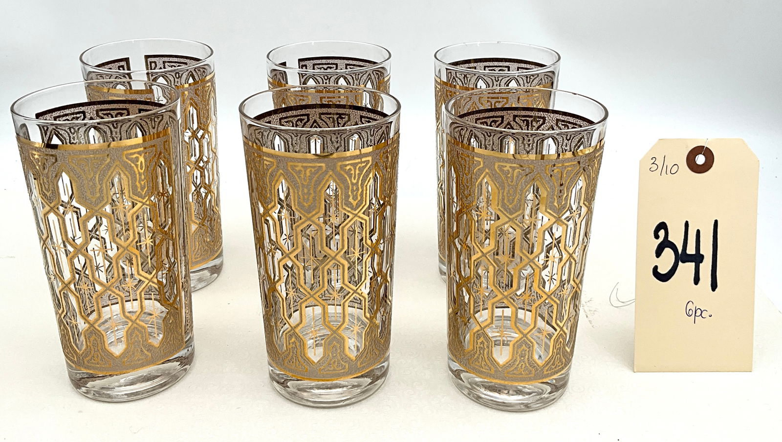Culver Valencia Style 22kt Gold Highball Glasses, Set of Six: This set of six mid-century modern highball glasses is attributed to Culver, Ltd. in the iconic Valencia pattern. Each glass features an ornate 22 karat gold-leaf lattice overlay accented by textured