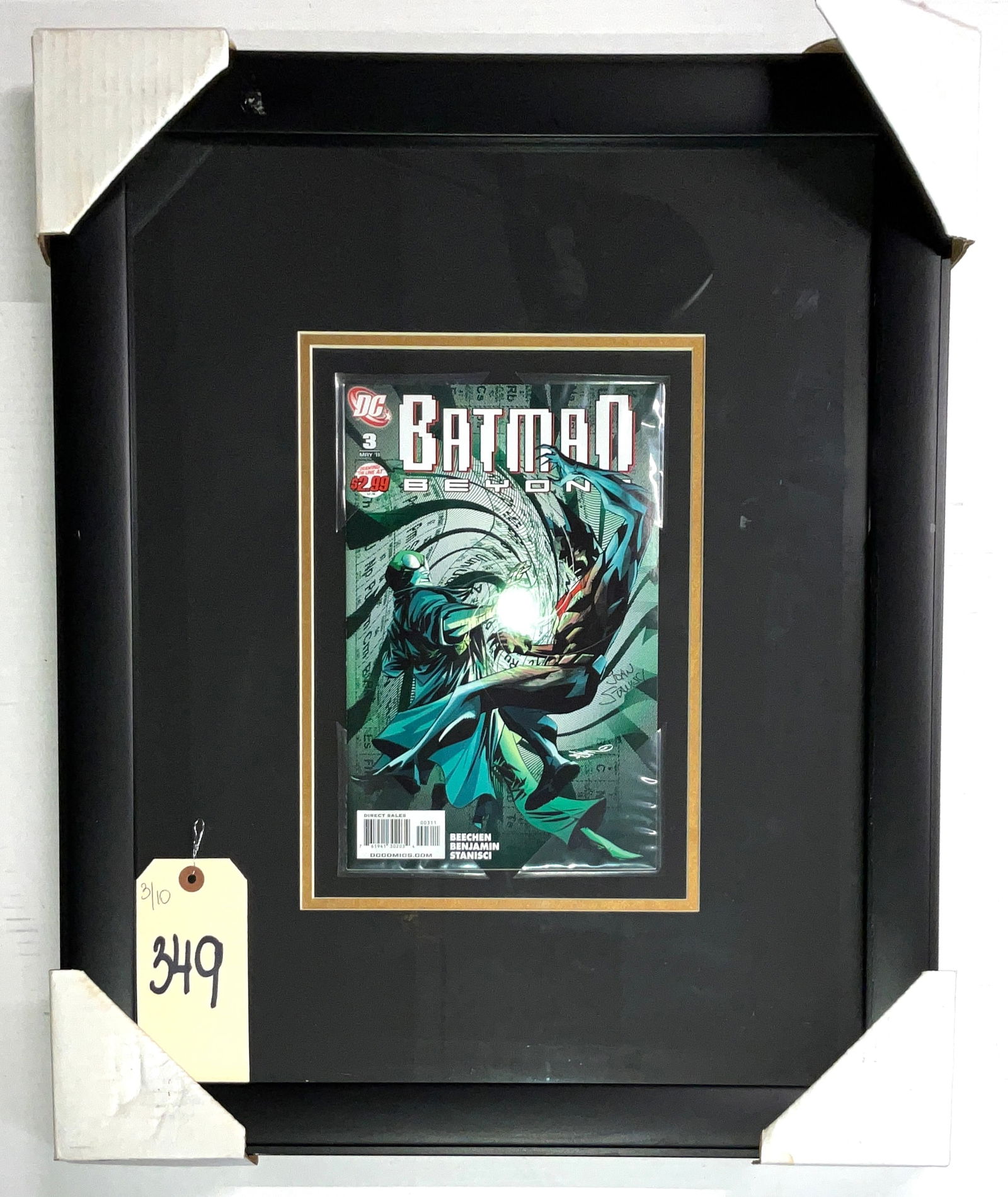 Framed Batman Beyond Vol. 3 No. 3 Signed Comic Book: This professionally framed collectible features a copy of DC Comics Batman Beyond Vol. 3, No. 3, dated May 2011, hand-signed on the front cover by artist John Stanisci in silver-toned ink. The comic i