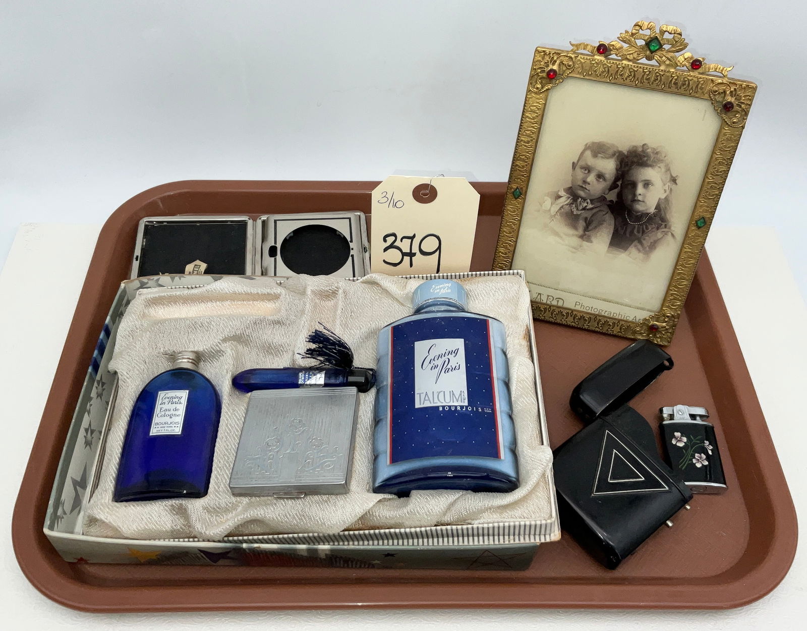 Bourjois Evening in Paris Vanity Set, Jeweled Gilt Brass Frame, and Accessories: This collection features a mid-20th-century Bourjois Evening in Paris gift set including cobalt blue perfume bottles, talcum powder, a silver-tone compact, and a lipstick tube. Accompanying the set is