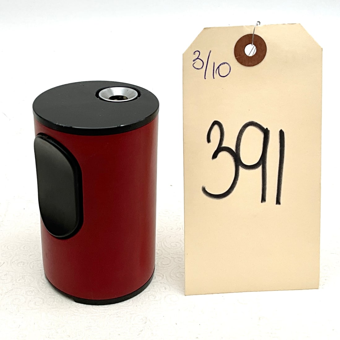 Braun Table Lighter, Designed by Dieter Rams, circa 1968: This Braun T2 permanent table lighter features a cylindrical red plastic housing with a contrasting black ignition button and top plate. Designed by Dieter Rams in 1968, the piece exemplifies the func