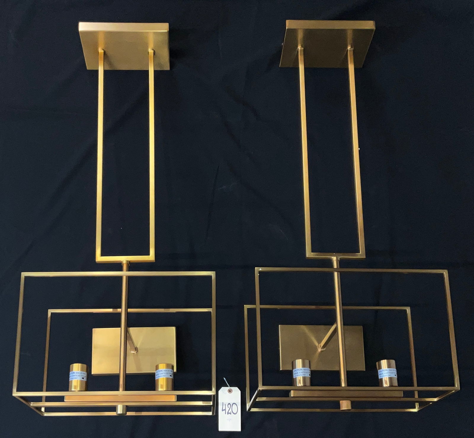 Crystorama Capri Pair of Modern Geometric Pendants in Antique Gold: This pair of new Crystorama Capri pendants features an architectural open-frame design composed of nested metal rectangles in a brushed antique gold finish. Each fixture contains two candle-style ligh