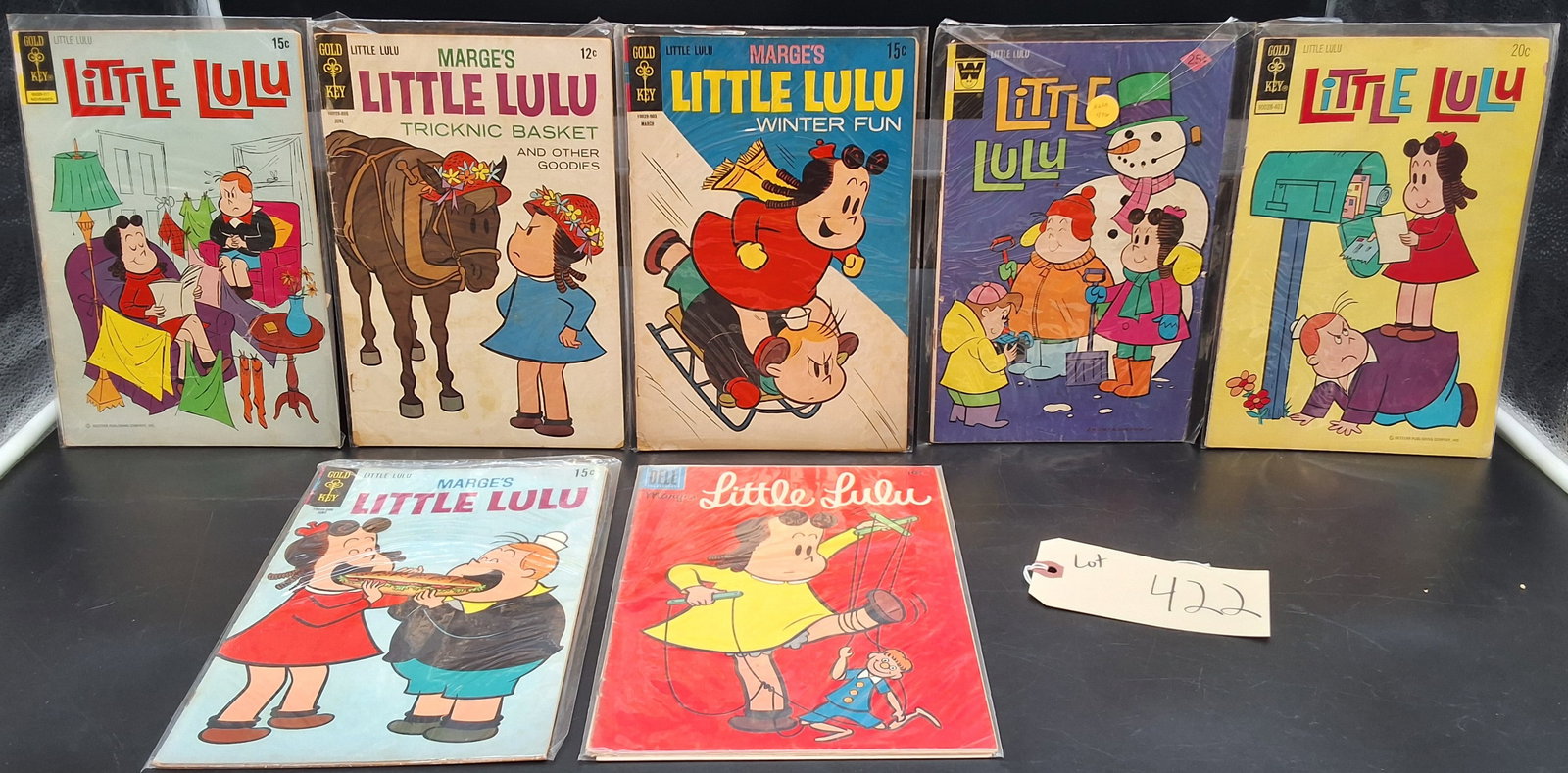 Lot of 7 Vintage Little Lulu Comics: Lot of 7 Vintage Little Lulu Comics Condition All property is sold in "as is" condition and all sales are final. Teel Auctions and its consignor make no representations or warranties, express or
