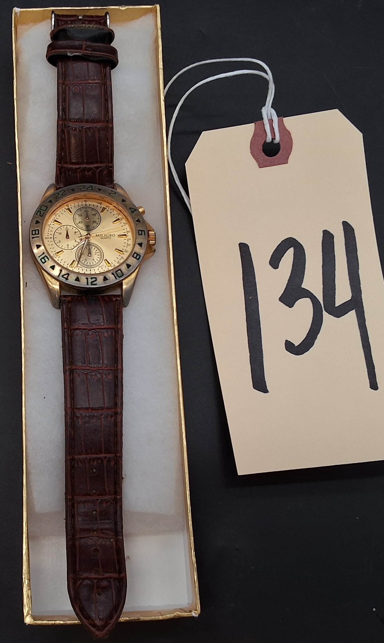 Milagro Men's gold tone chronograph watch: Milagro Men's gold tone chronograph watch Condition All property is sold in "as is" condition and all sales are final. Teel Auctions and its consignor make no representations or warranties, express or