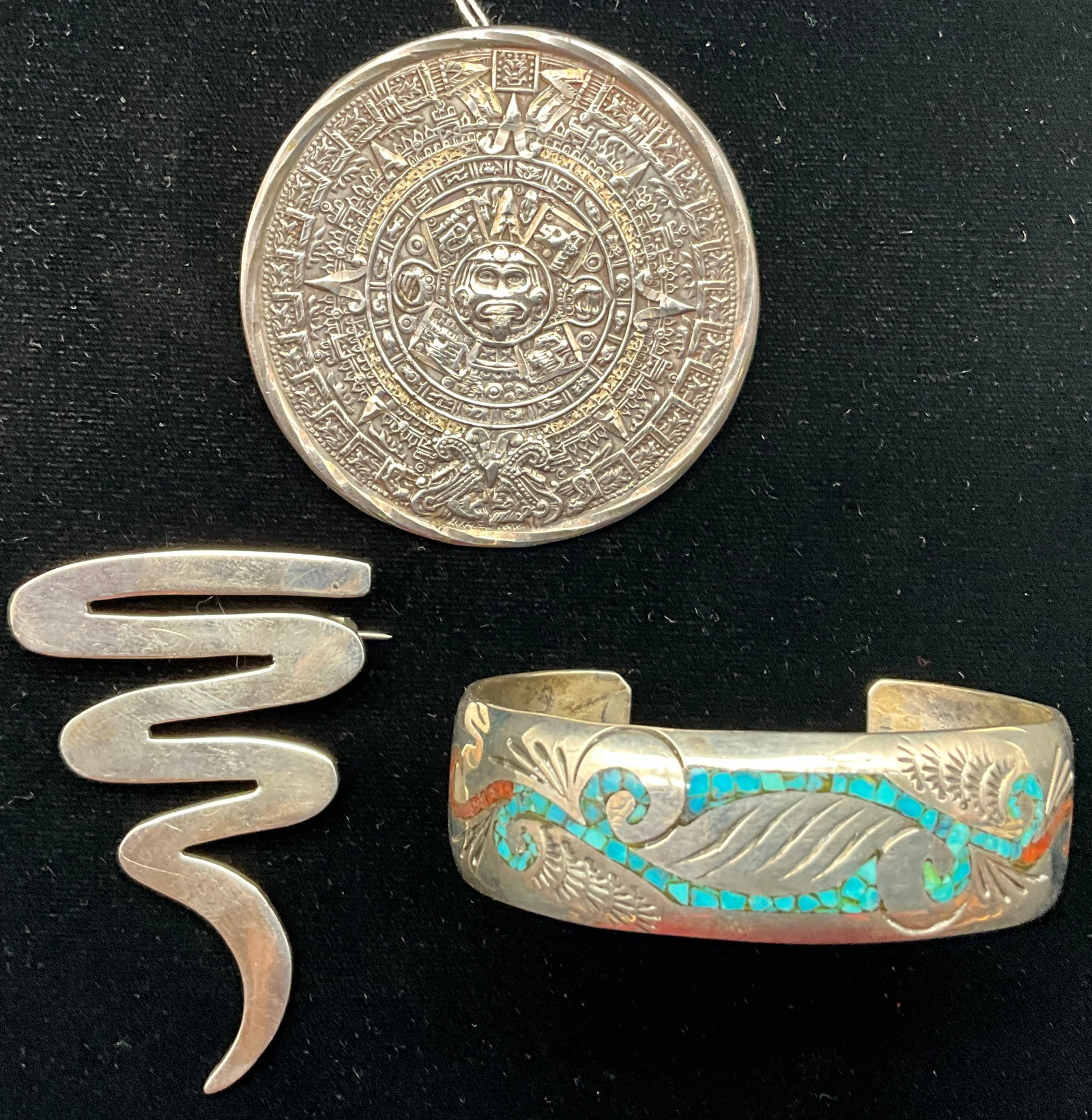 A Trio of Mexican Sterling Silver Jewelry Items Including an Aztec Calendar Pendant - 2