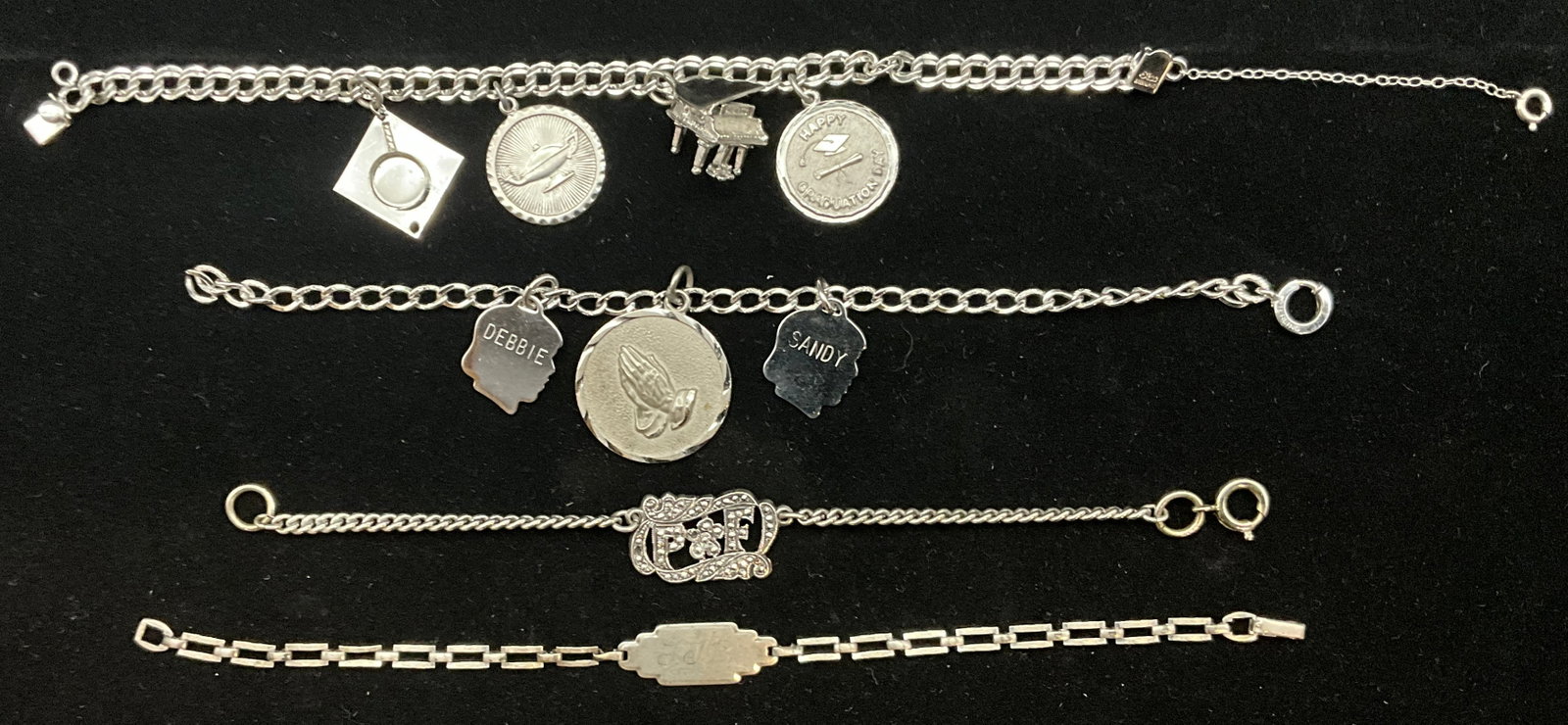 A Collection of Vintage Sterling Silver Bracelets Featuring Charm and Identification Styles - 2