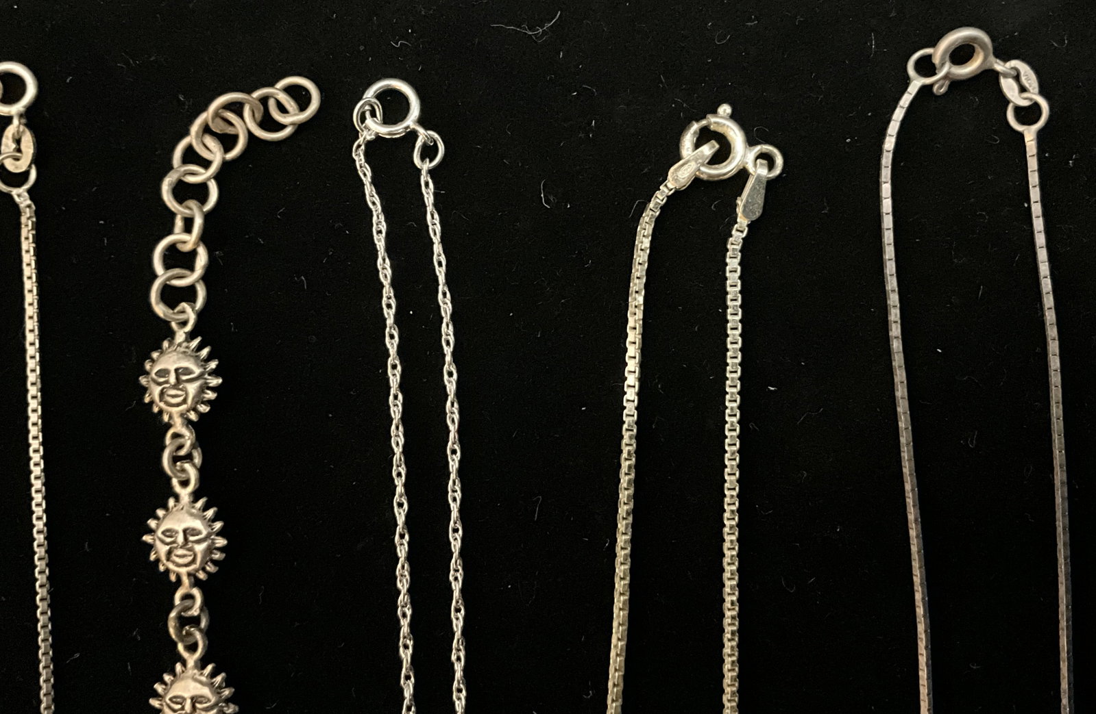 A Group of Seven Sterling Silver Necklaces and a Sun Face Motif Bracelet - 4