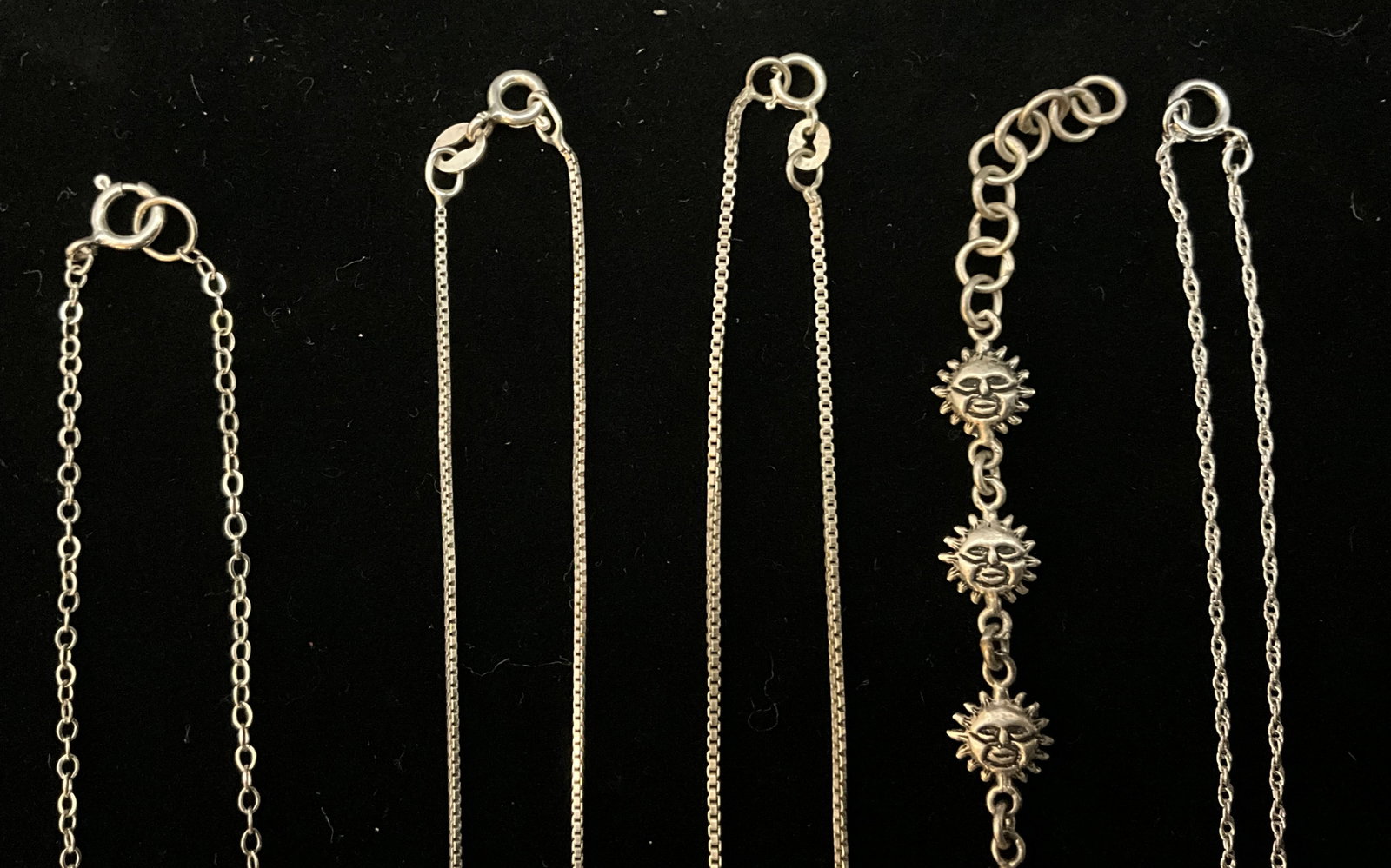 A Group of Seven Sterling Silver Necklaces and a Sun Face Motif Bracelet - 5