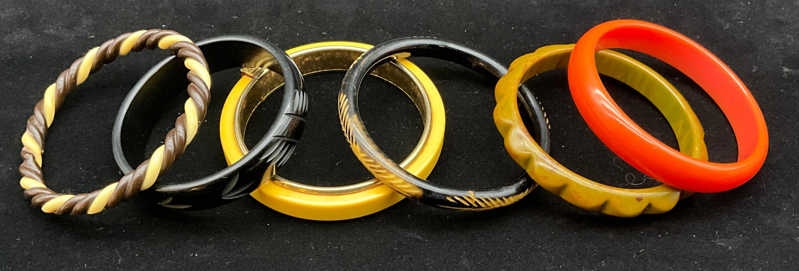 A Collection of Vintage Carved Bakelite Bangle Bracelets - 2