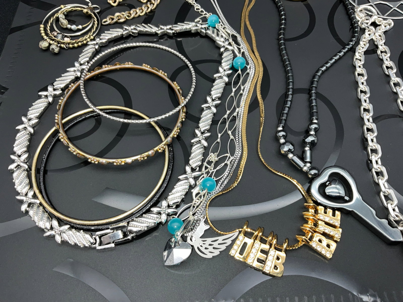 An Assortment of Contemporary Costume Jewelry Featuring Personalized Charms - 2