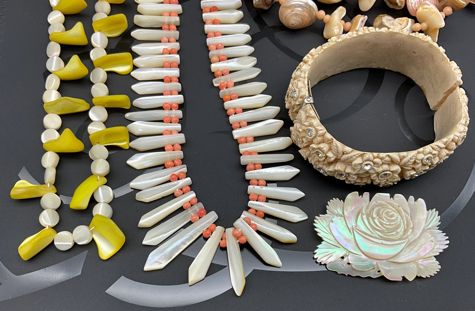 A Group of Mid-Century Shell, Coral, and Carved Floral Costume Jewelry - 2
