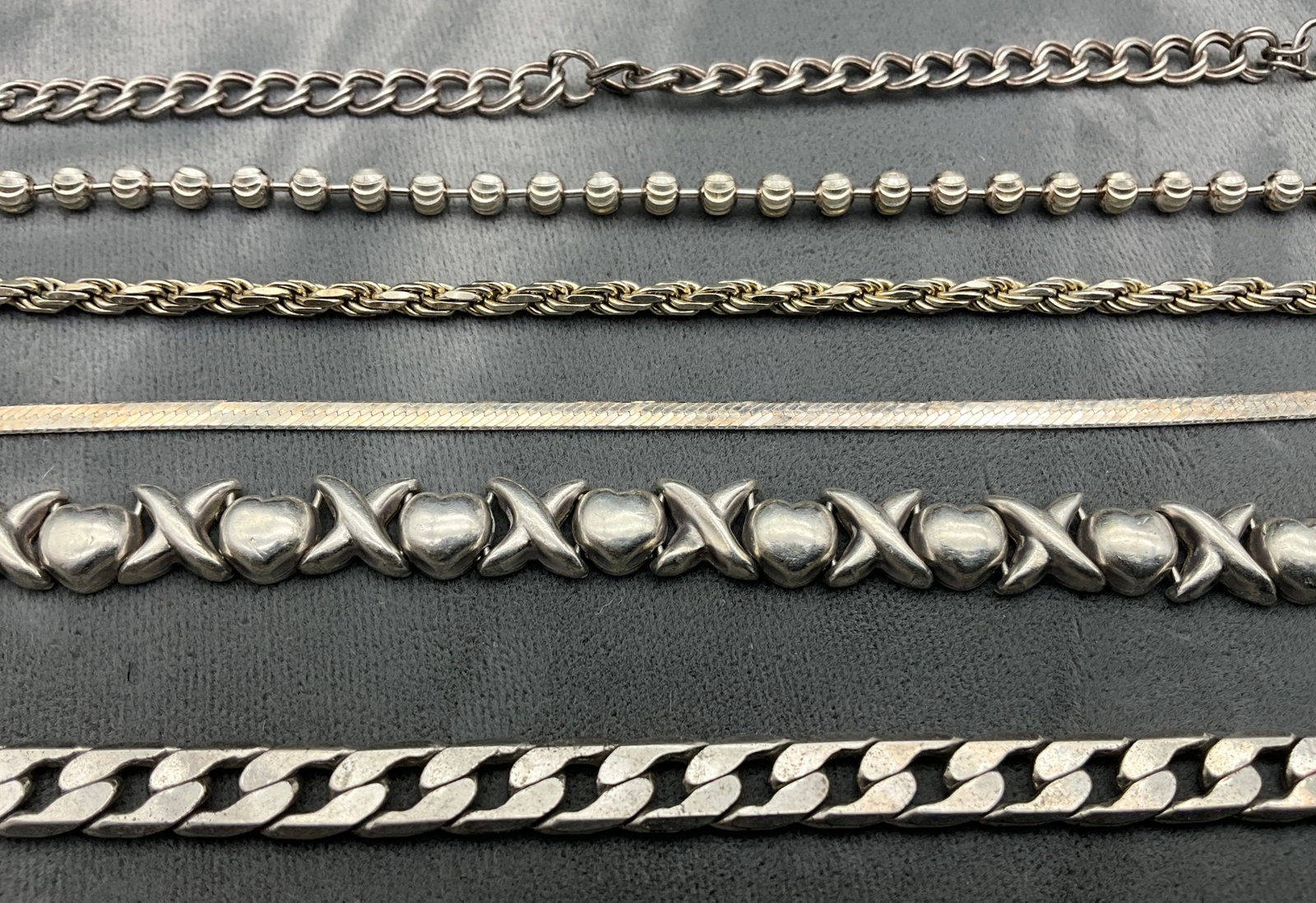 An Assortment of Sterling Silver Chain and Link Bracelets - 2
