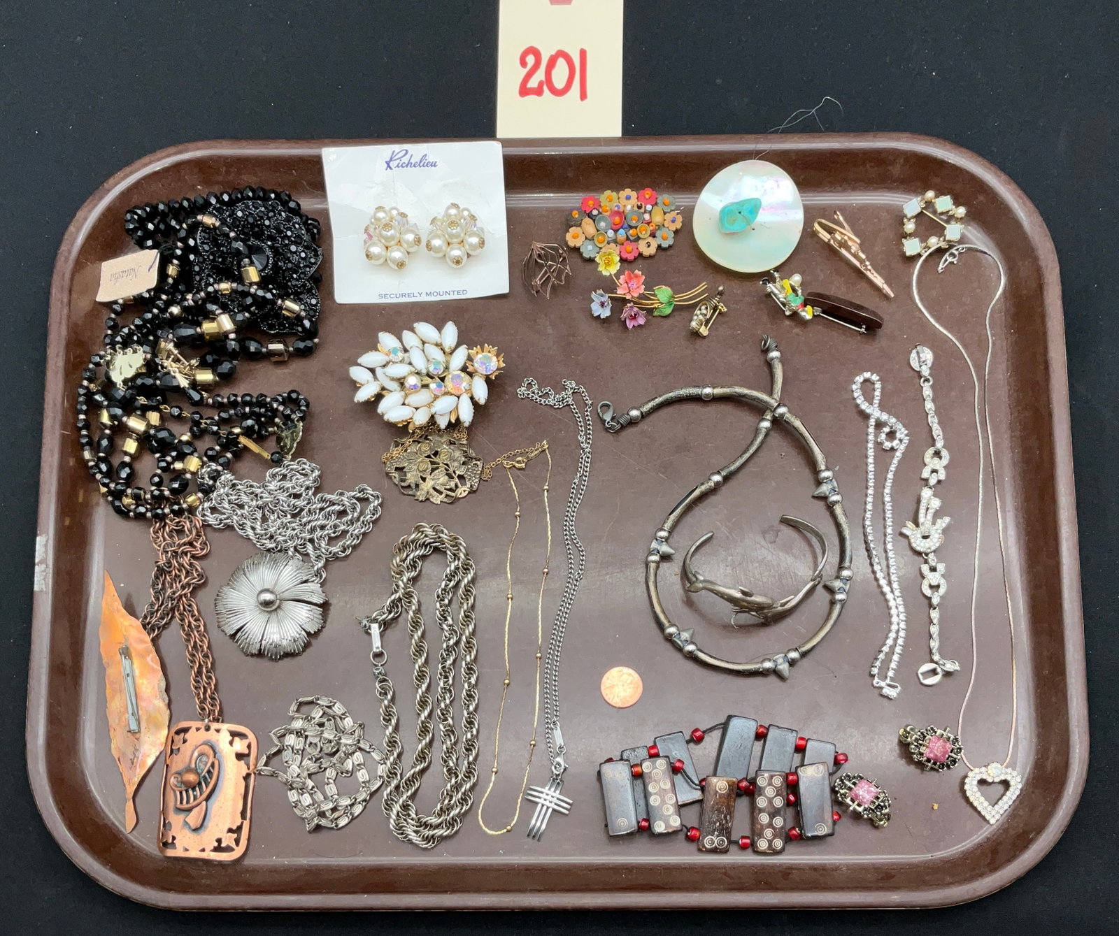An Assortment of Vintage Signed and Modernist Costume Jewelry: This collection includes an assortment of vintage costume jewelry featuring signed pieces by Richelieu, Napier, Natasha, and Molpert. The lot encompasses a variety of necklaces, bracelets, brooches,