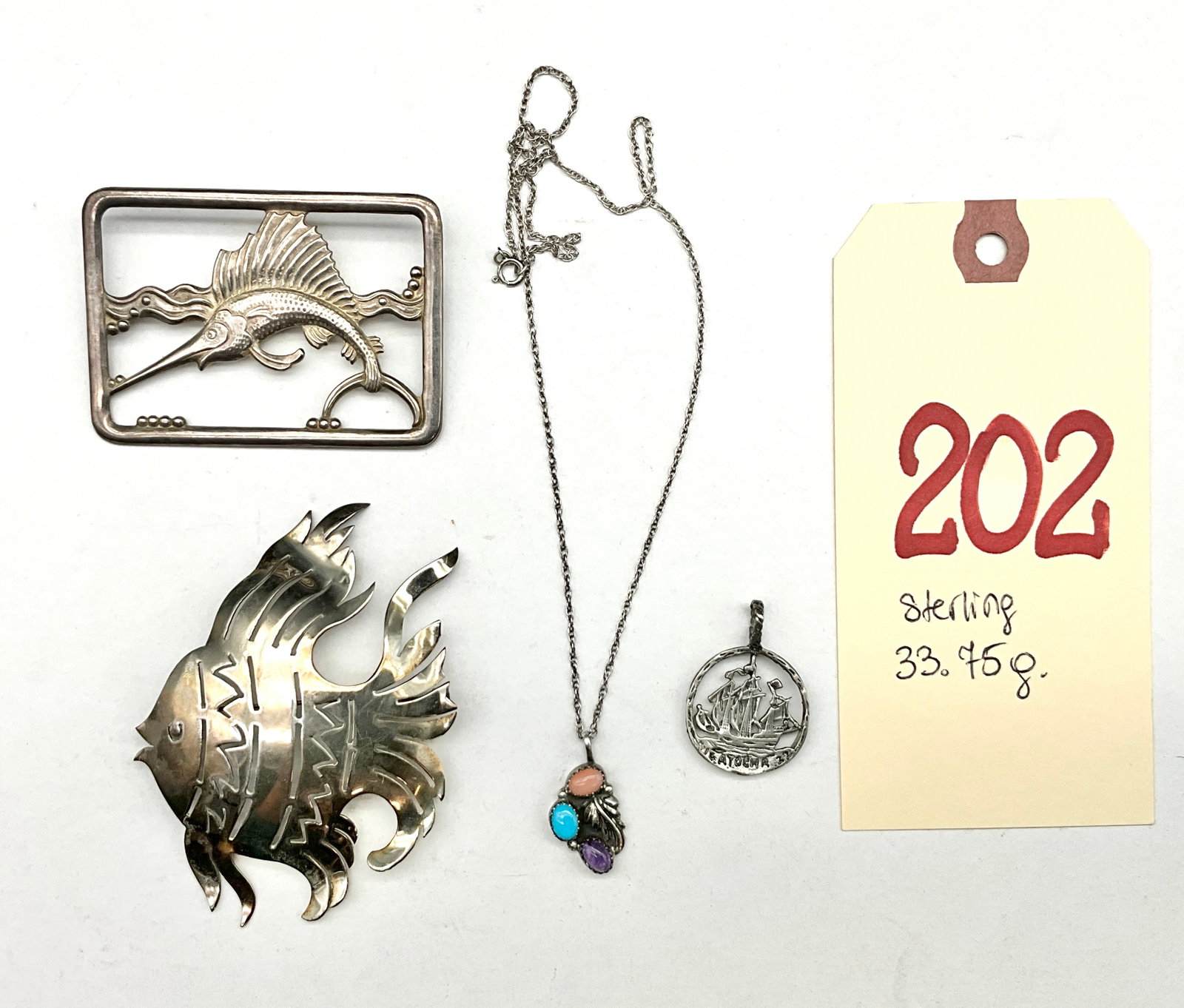 A Collection of Sterling Silver Nautical and Nature Themed Jewelry: This collection of sterling silver jewelry features several pieces with nautical and maritime themes. Included are two large fish brooches, one stylized and textured and the other a sailfish jumping