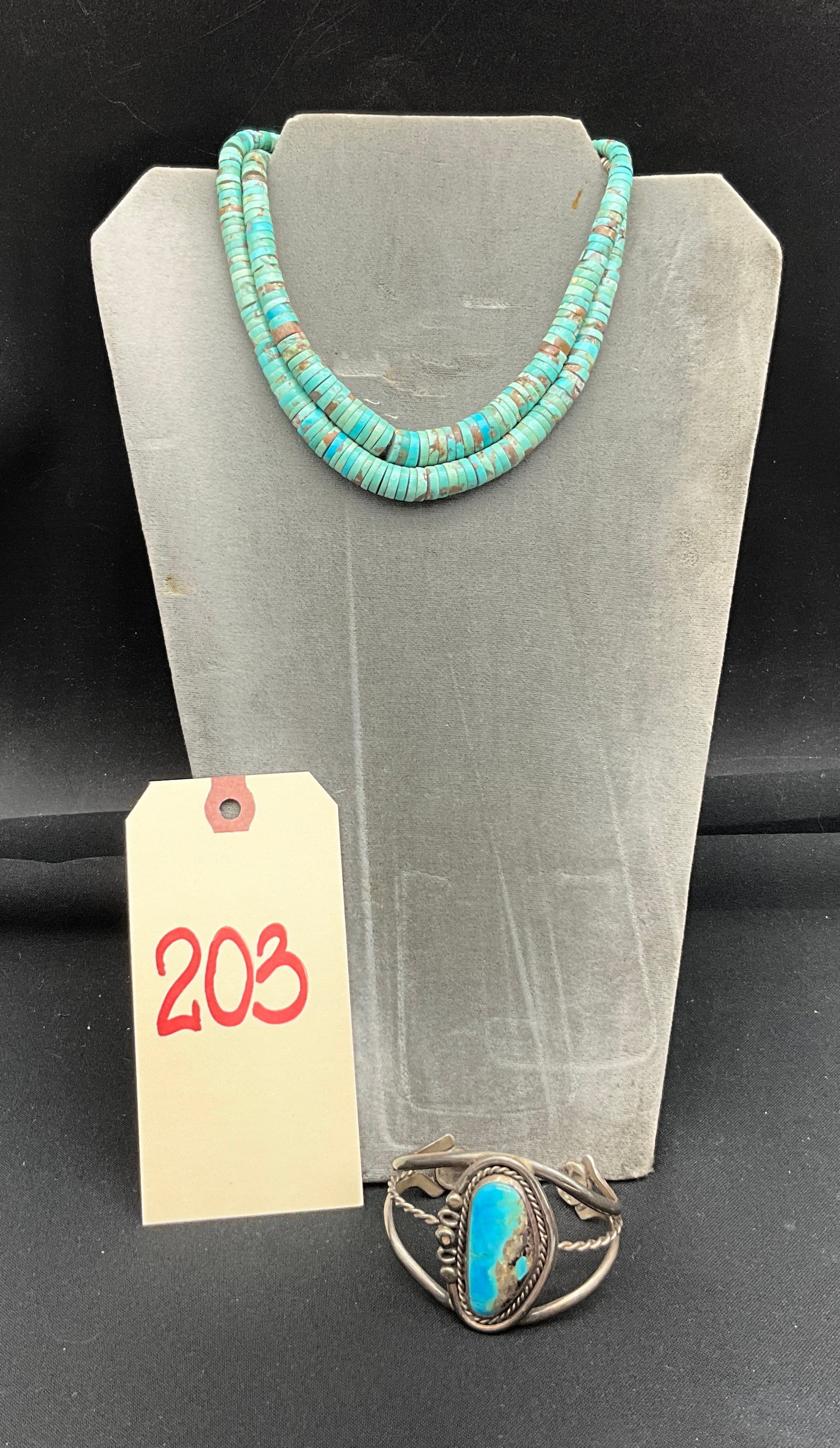 A Southwestern Two-Strand Turquoise Heishi Necklace and Turquoise Cuff Bracelet: This Southwestern jewelry set includes a two-strand graduated turquoise disc bead necklace and a three-wire split-shank turquoise cuff bracelet. The necklace features light green and sky blue