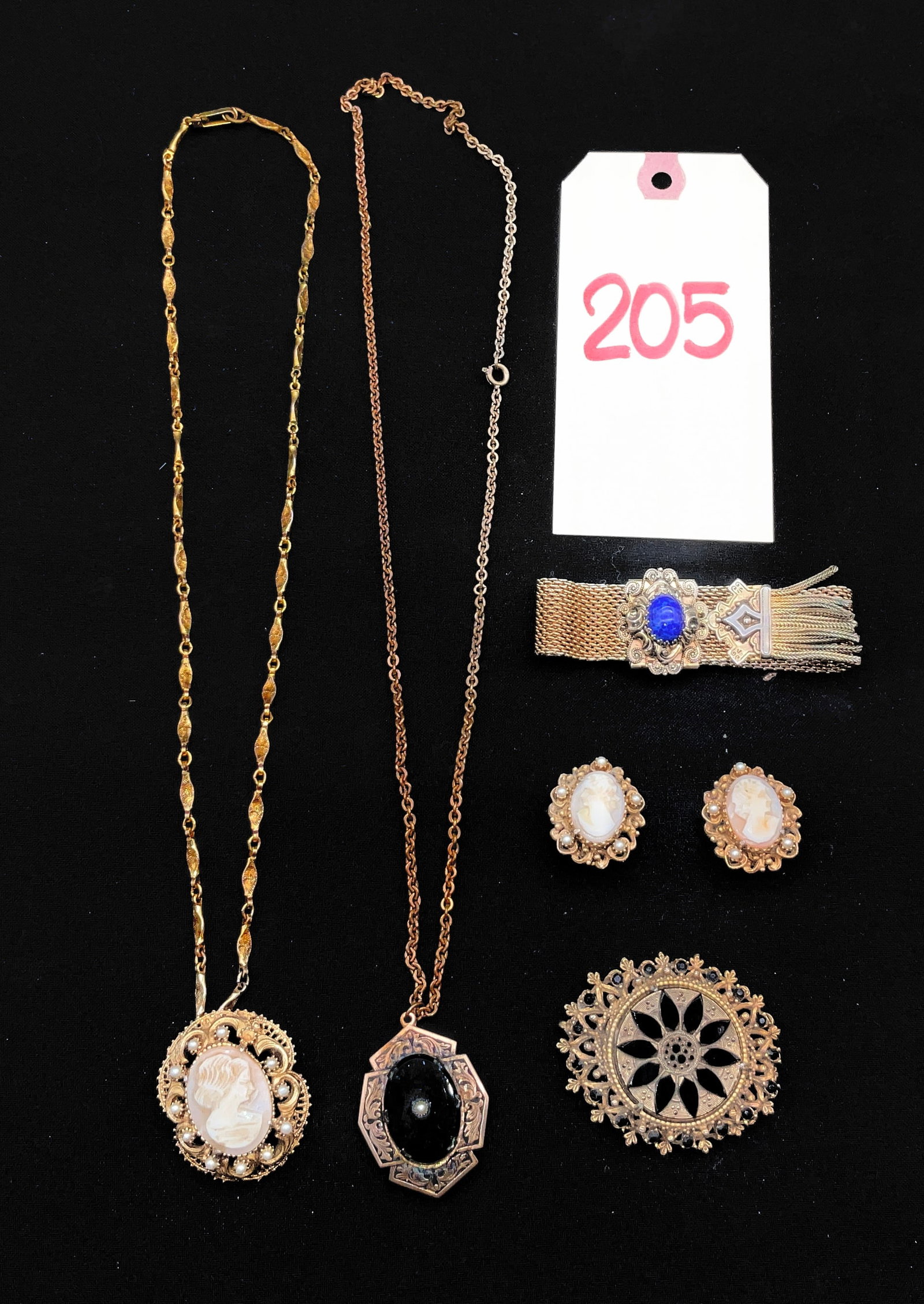 An Assortment of Vintage Florenza and Victorian Revival Costume Jewelry: This collection of gold-tone costume jewelry includes two signed pieces by Florenza featuring a carved shell cameo pendant brooch with faux pearl accents and a large circular brooch set with faceted