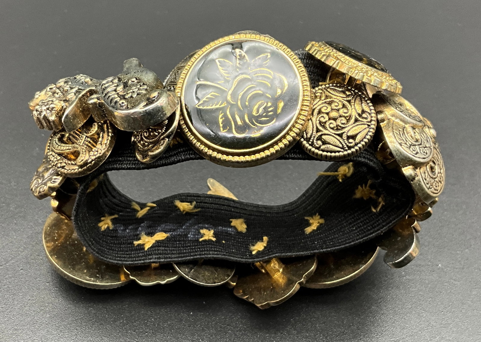 A Collection of Four Vintage Gold-Tone Costume Jewelry Charm and Button Bracelets - 5