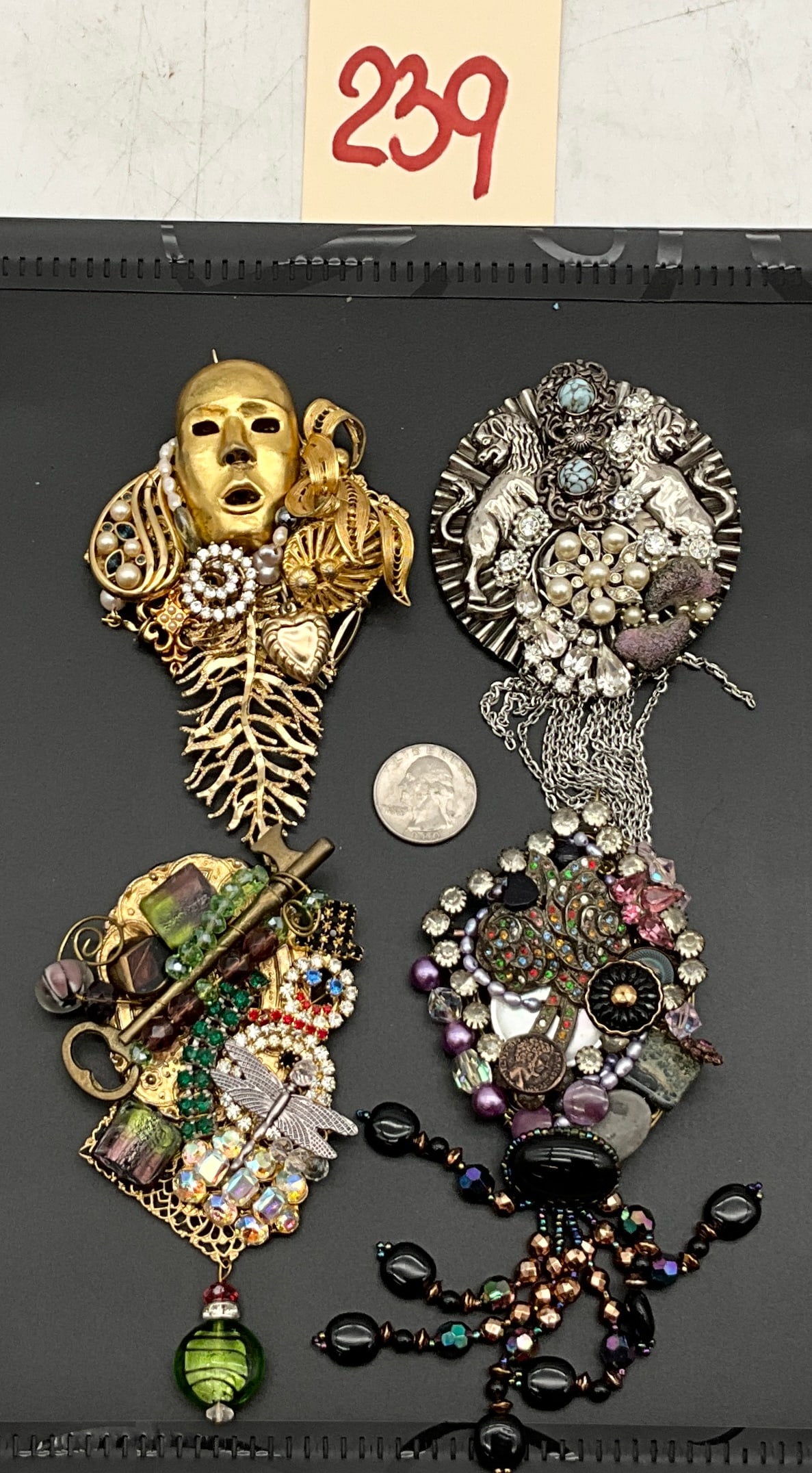 Four Sarah Jane Mixed Media Assemblage Brooches: This collection consists of four large artisan assemblage brooches by Sarah Jane featuring unique combinations of multi-era jewelry components. Each piece is signed in silver ink on a black leather