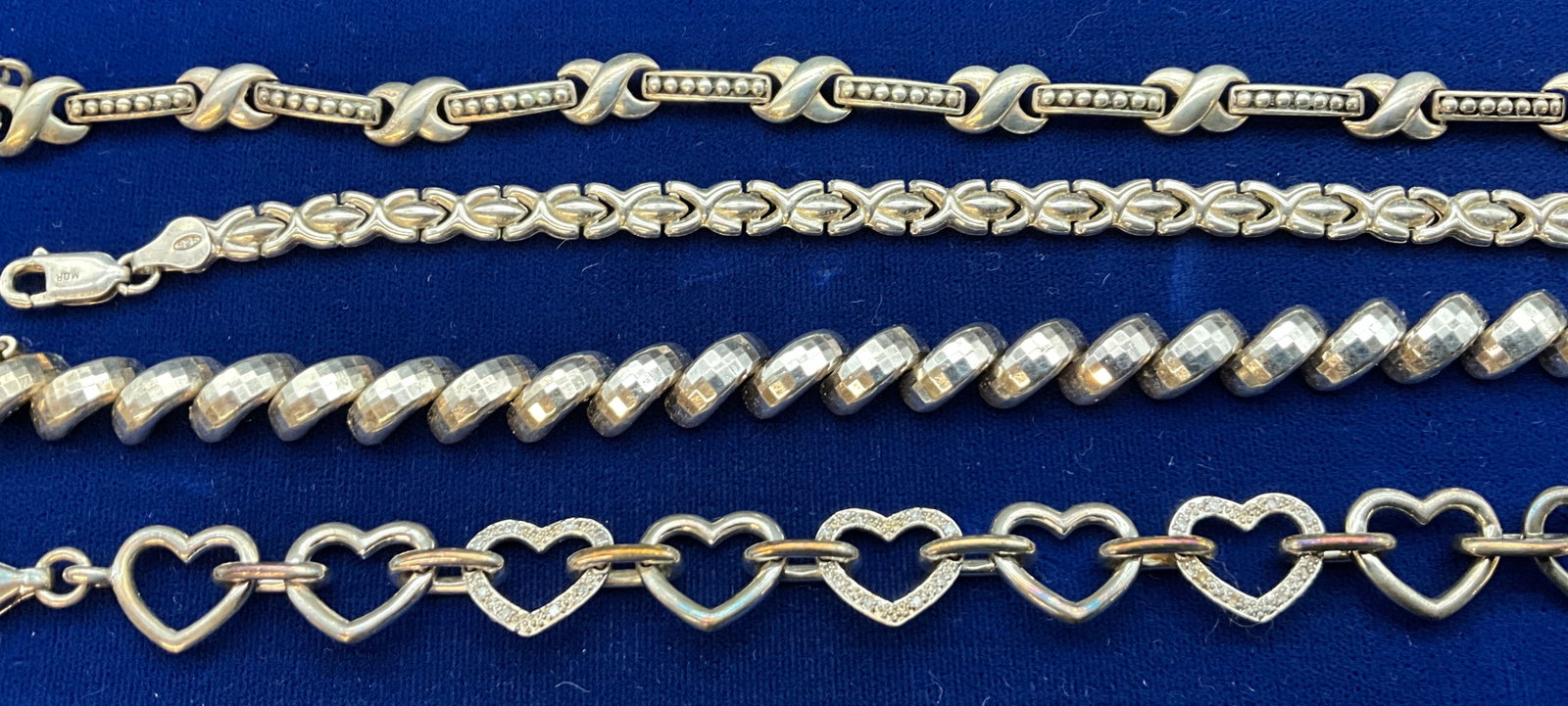 A group of four sterling silver bracelets - 2