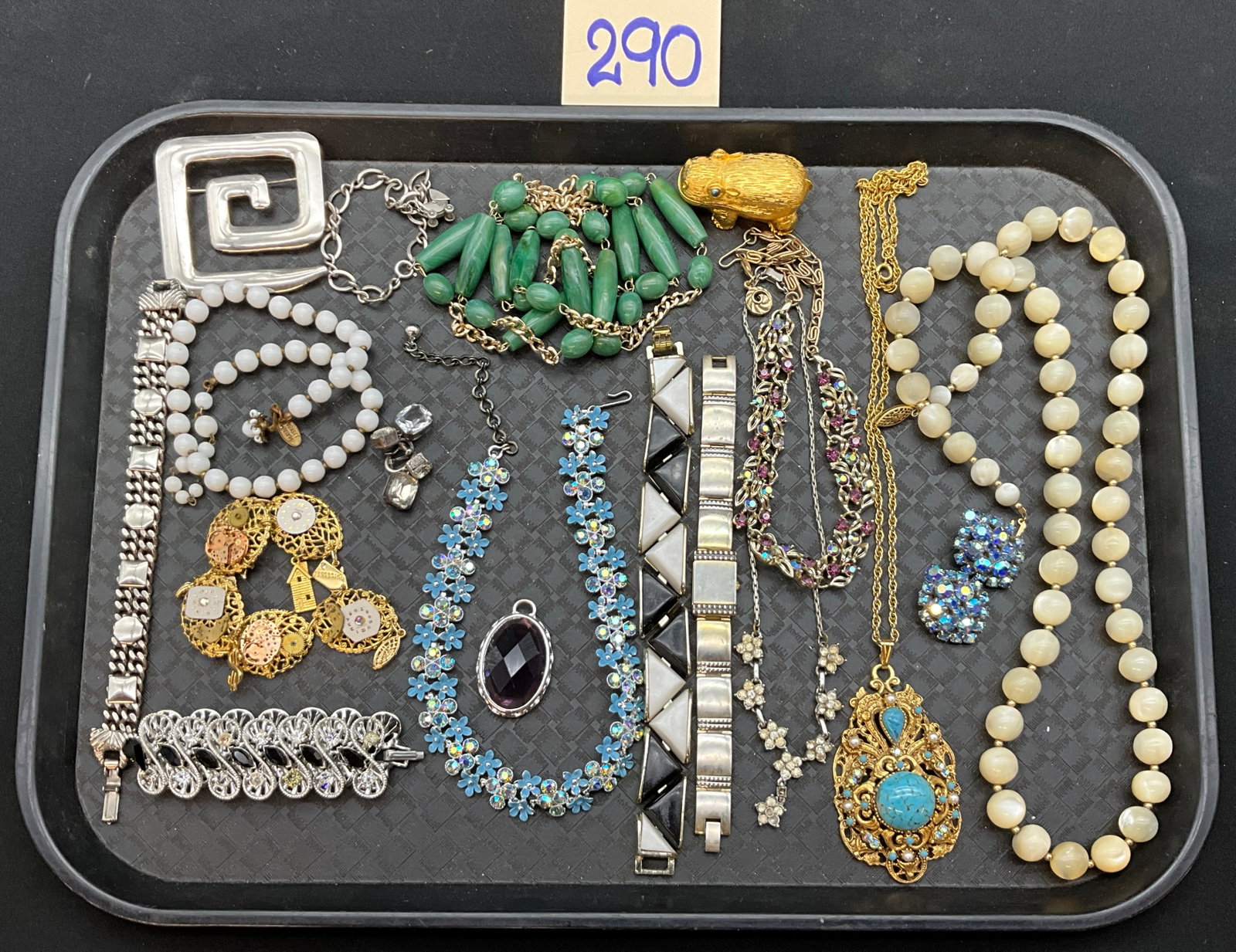 A Collection of Vintage Assorted Costume Jewelry Including Florenza: This collection features an assortment of vintage costume jewelry including necklaces, bracelets, earrings, brooches, a wristwatch, and a figural hippopotamus perfume compact. The pieces are
