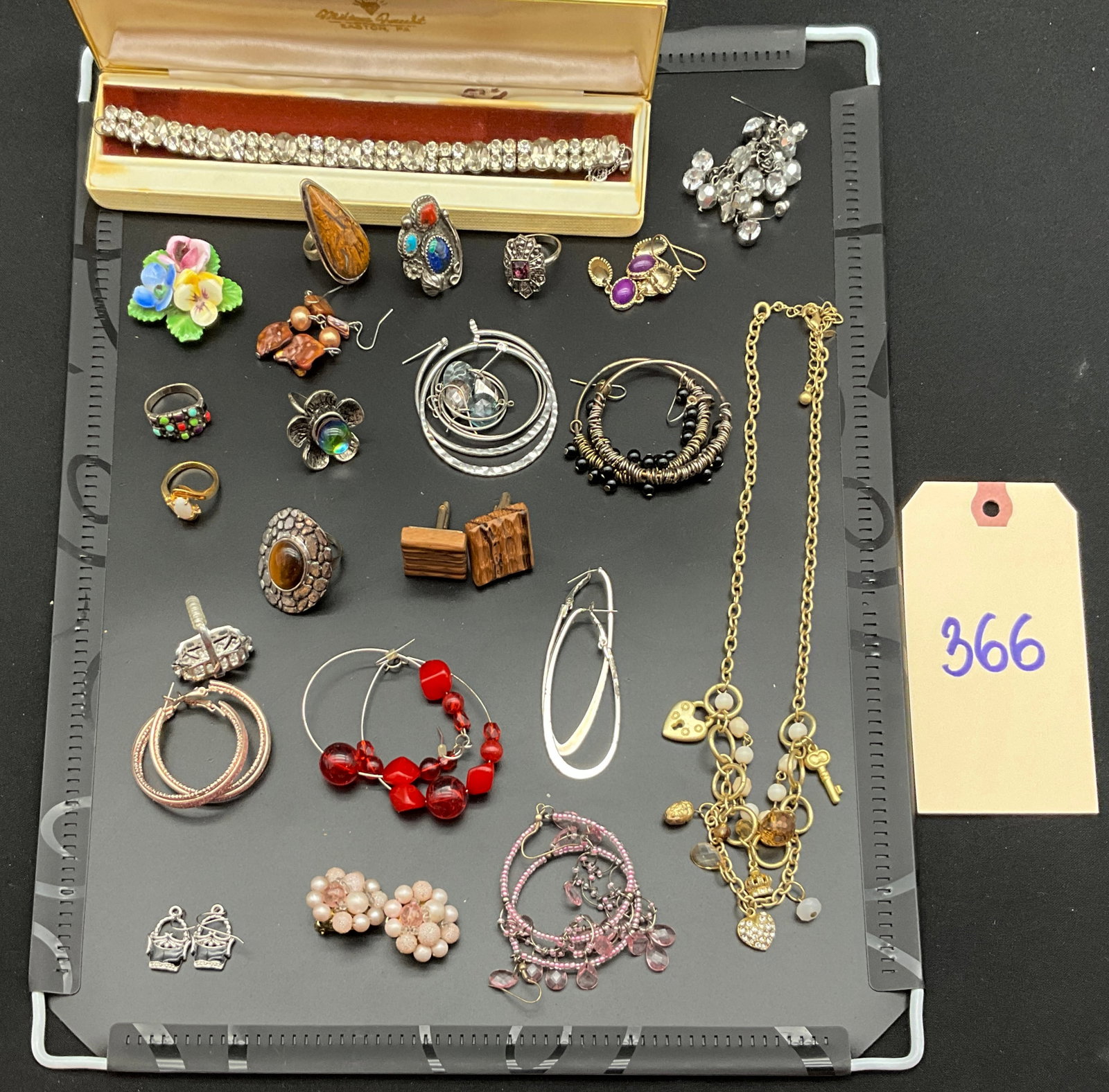 An Assortment of Vintage and Contemporary Costume Jewelry: This collection features vintage and contemporary costume jewelry including necklaces, bracelets, rings, earrings, cufflinks, and a brooch fabricated from silver, gold-tone, and copper-tone base metal