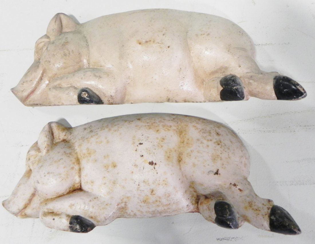 PAIR OF CAST IRON PIGS: PAIR OF CAST IRON PIG DOORSTOPS MEASURES 17.5"W X 6.5"H