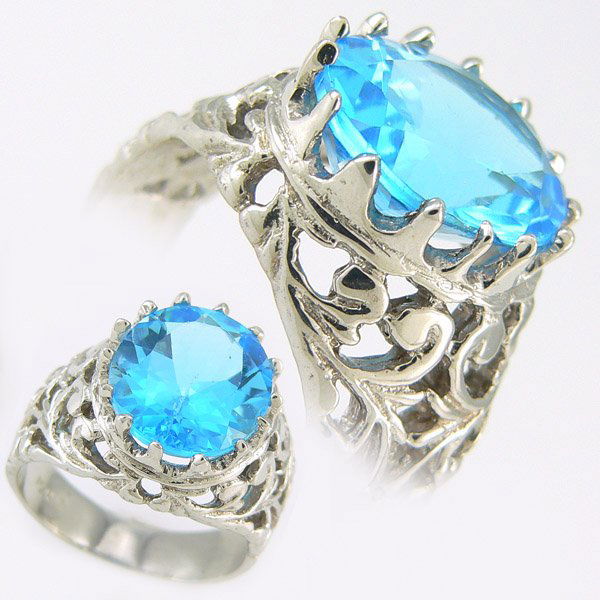 BLUE TOPAZ RING 10.0 CTW 10KT. GOLD: BIG, BOLD & BEAUTIFUL - ELEGANT 10.00 CTW BLUE TOPAZ RING SET IN 10K WHITE GOLD GEMSTONE: 1 OVAL BLUE TOPAZ 10.0 CTW GOLD WEIGHT: APPROXIMATELY 9.70 GRAMS SIZE: 9 1/4 DIMENSIONS: APPROX. 9/16" X 7/16"