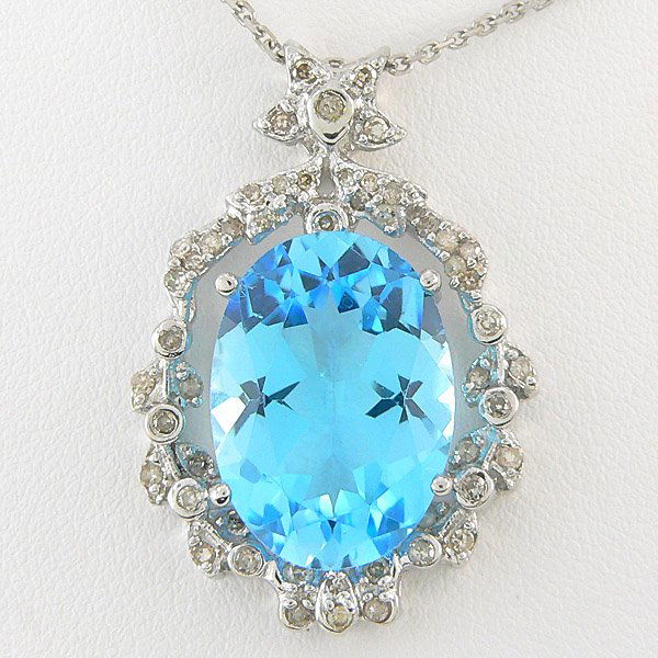 DIAMOND & TOPAZ NECKLACE 18.80 CTW 14KT.: BIG, BOLD & BEAUTIFUL - ANTIQUE STYLE 18.80 CTW DIAMOND & BLUE TOPAZ NECKLACE IN 14K WHITE GOLD WITH 16" CHAIN GEMSTONE: 1 OVAL CUT BLUE TOPAZ 18.0 CTW DIAMOND: 52 ROUND DIAMONDS 0.80 CTW CLARITY: SI3