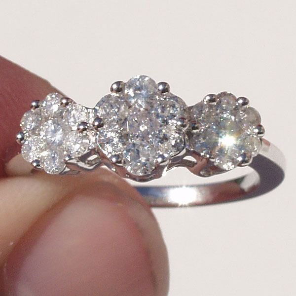 Gorgeous 14KT 1 Carat Diamond Ring 1.00 TCW: Gorgeous 1 Carat Diamond Ring. Get the big and bold look at auction! 21 gorgeous round brilliant cut diamonds weighing a total of 1 full carat! This ring is a real stunner. Set in 14Kt. white gold, Si