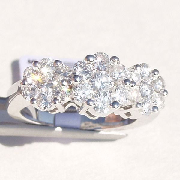 Stunning 14KT 2 Carat Diamond Ring! 2.00 TCW: Stunning 2 Carat Diamond Ring. Get the big and bold look at auction! 21 gorgeous round brilliant cut diamonds weighing a total of 2 full carats! This ring is a real stunner. Set in 14Kt. white gold, S