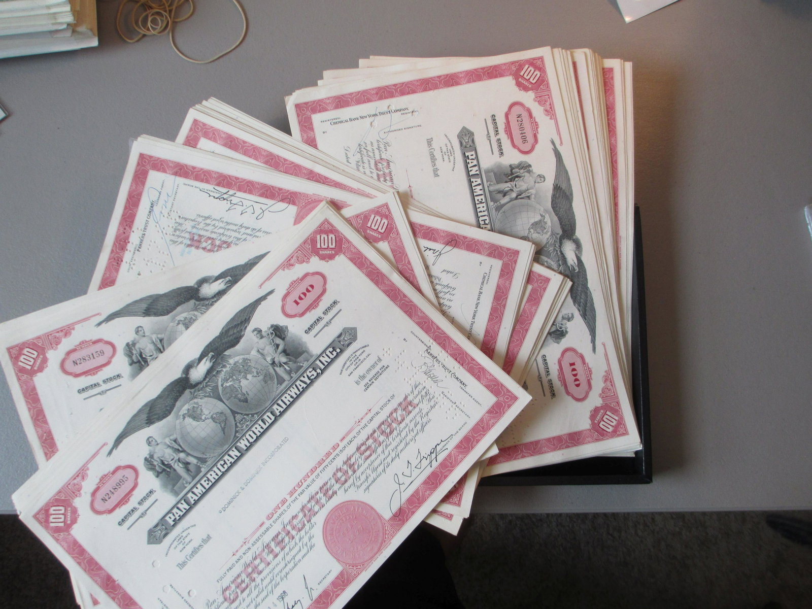lot of 100 pan american world airways inc stock: all original stock certificate hoard