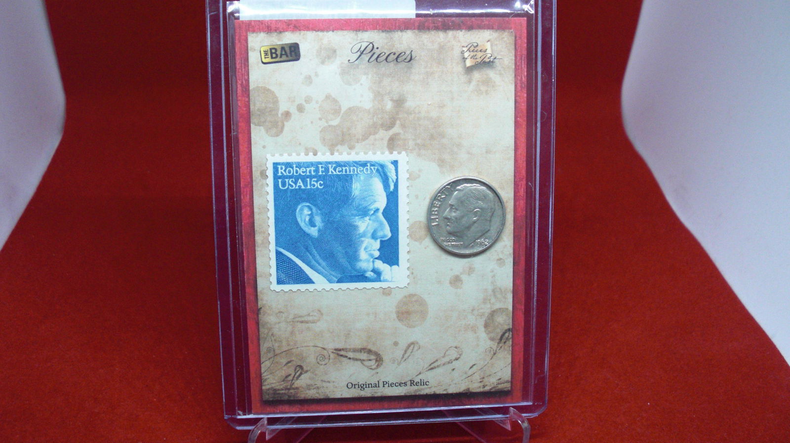 the bar 1/1 kennedy stamp and 1962 dime (1 of 1)