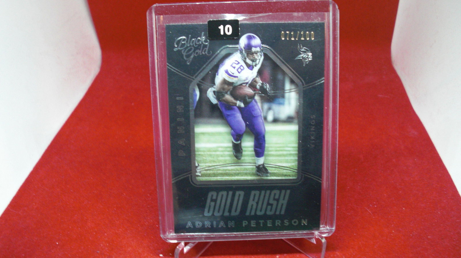 adrian peterson blak gold no.71/100: in top loader