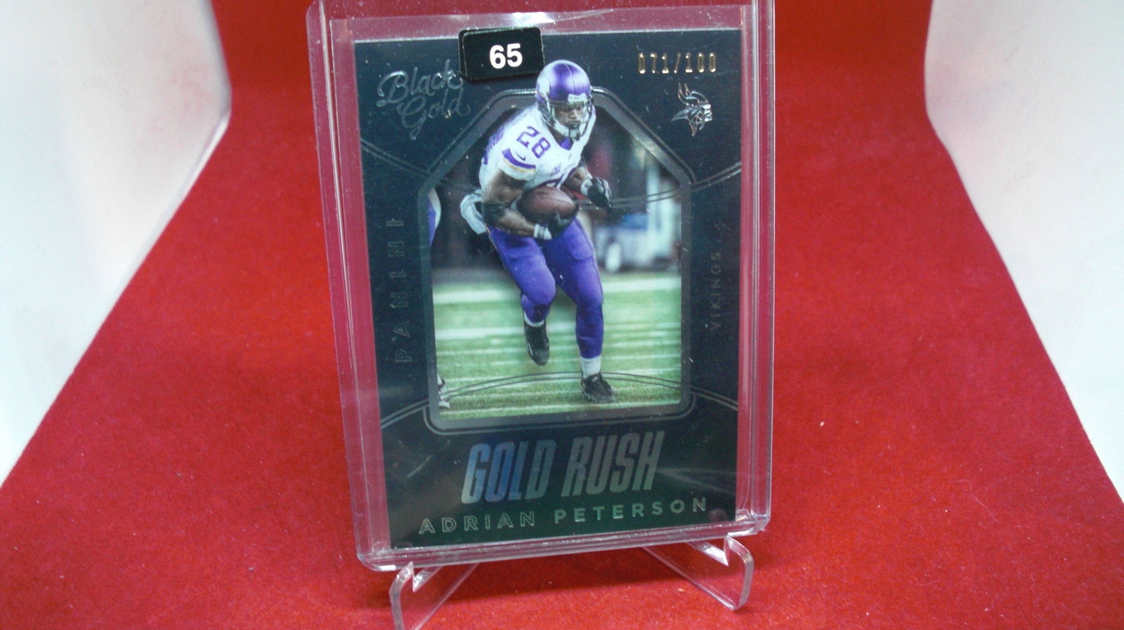 adrian peterson black gold #071/100: in top loader