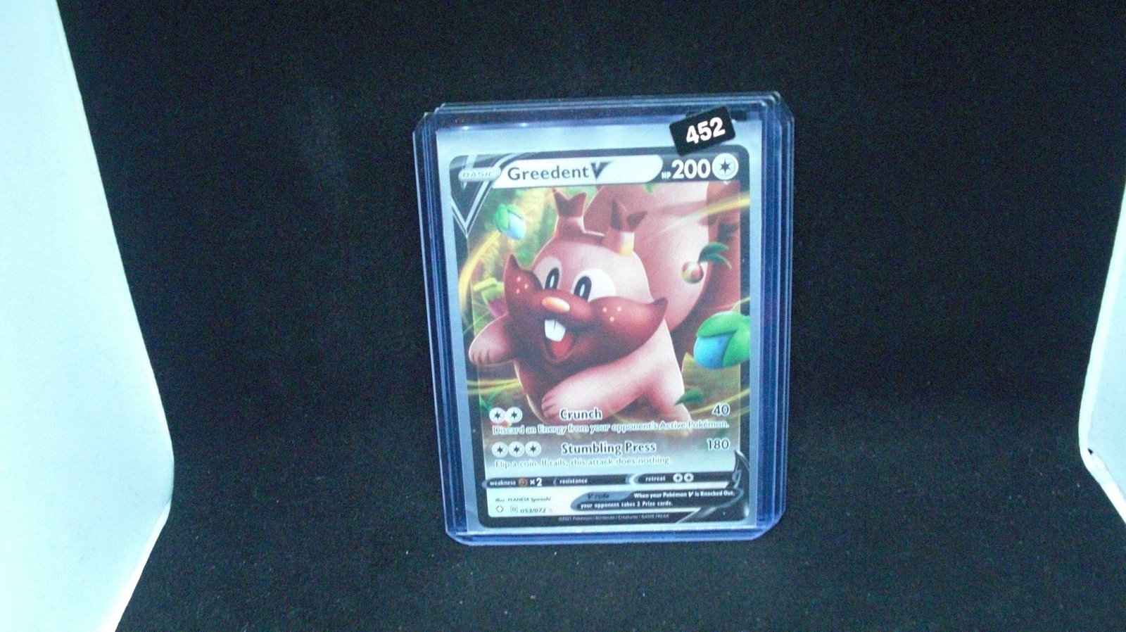 pokemon holo foil card greedent: in top loader