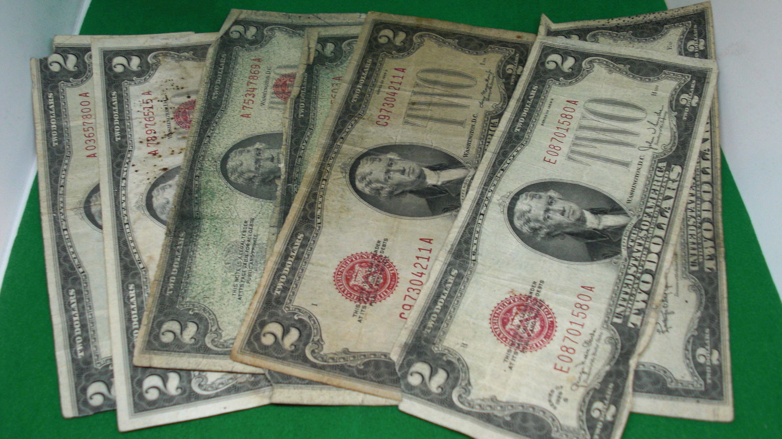 lot of 7 $2 dollar bill red seals (1 of 1)