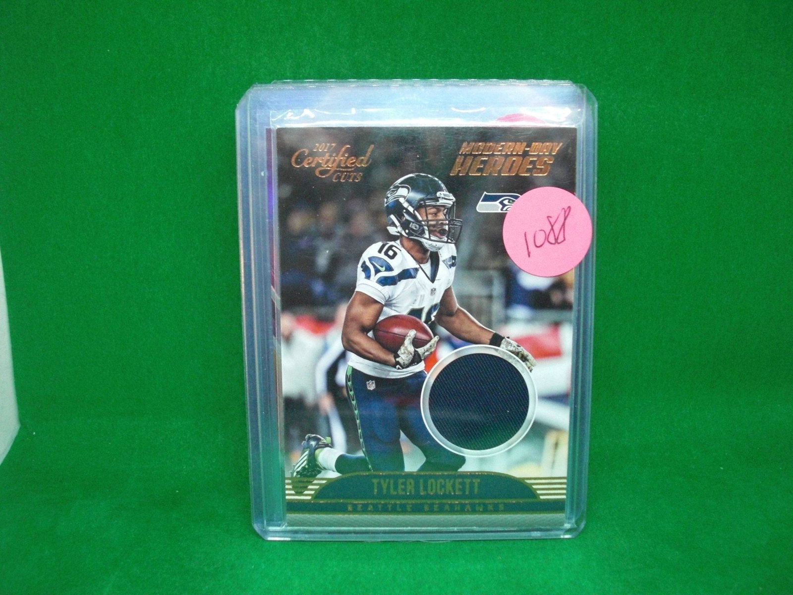 tyler lockett jersey card: in top loader