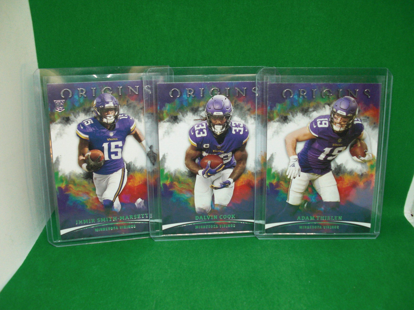 Lot of three origins Minnesota Vikings: in top loader