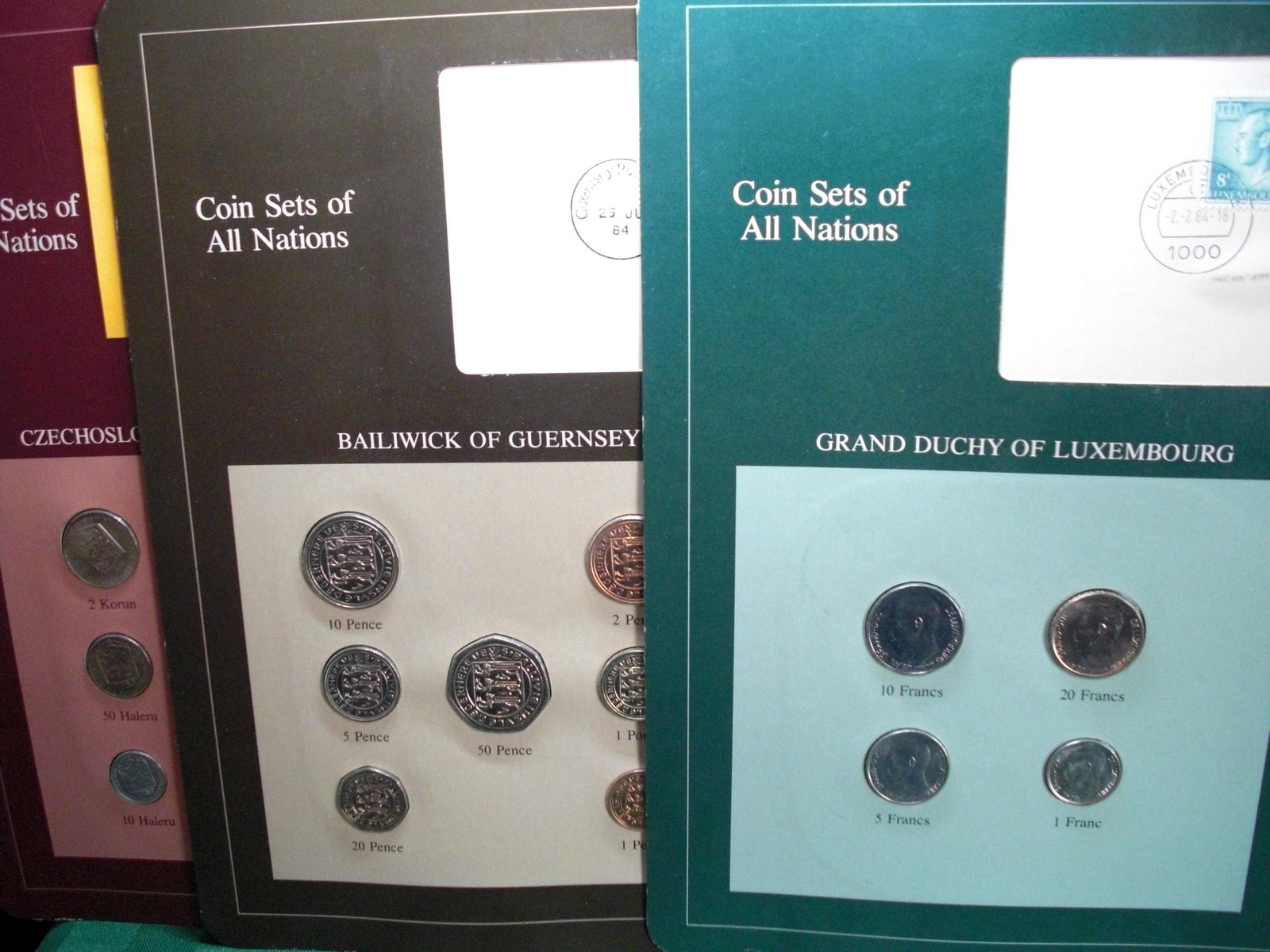 COIN SETS OF ALL NATIONS COIN SETS ON DISPLAY BOARD: WORLD COIN SETS