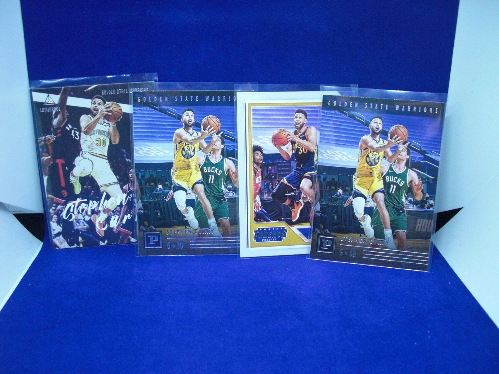 Lot of four Steph Curry cards (1 of 1)