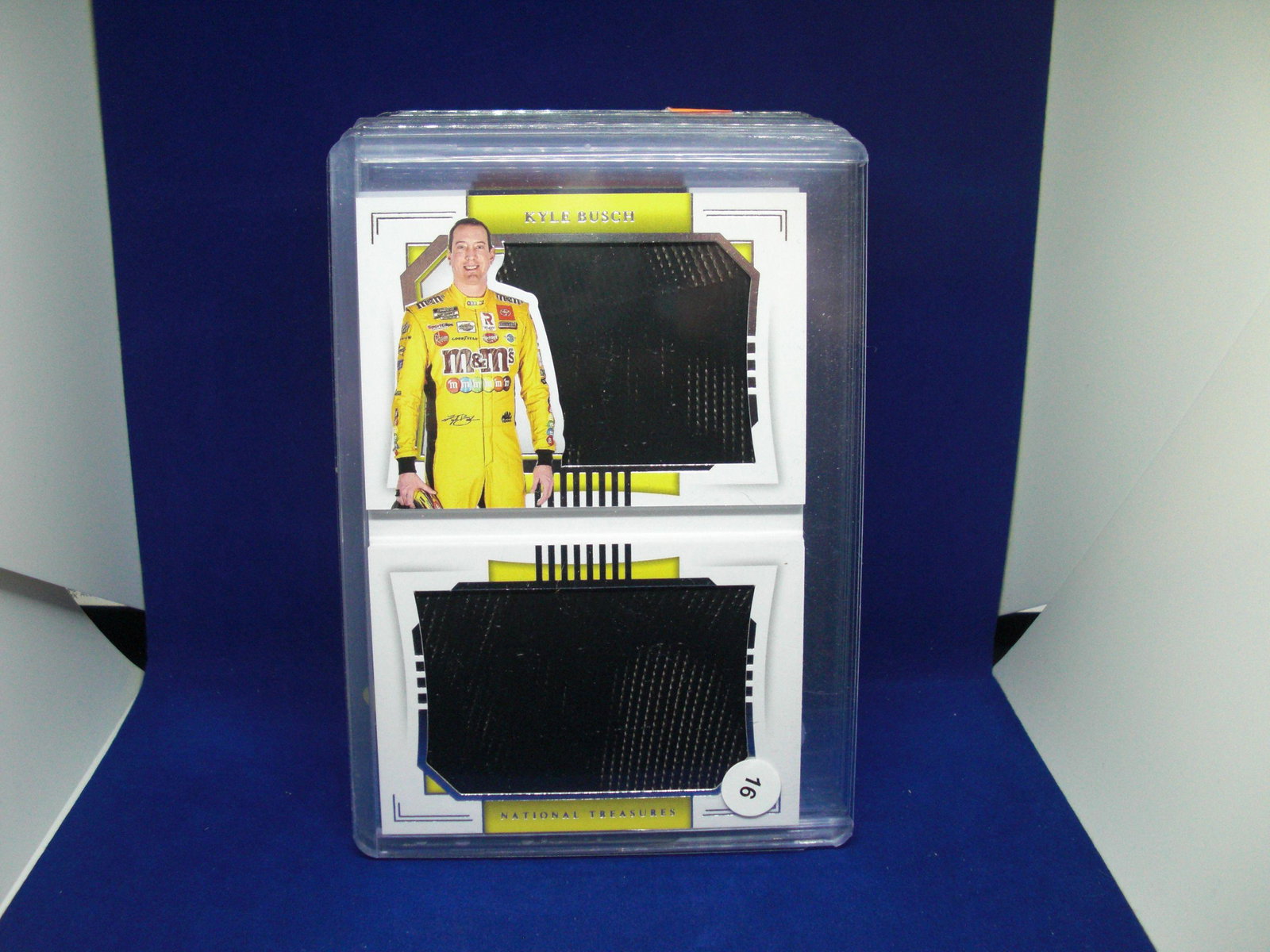 KYLE BUSCH NATL TREASURES BOOKLET NUMBERED 23/25: KYE BUSCH RACE USED TIRES RELIC